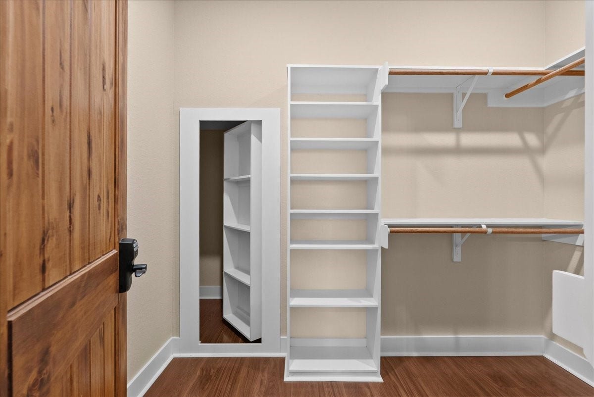 103 Begonia, Lake Jackson, TX 77566 Primary walk-in closet with built-in shelving and access to hidden storage space