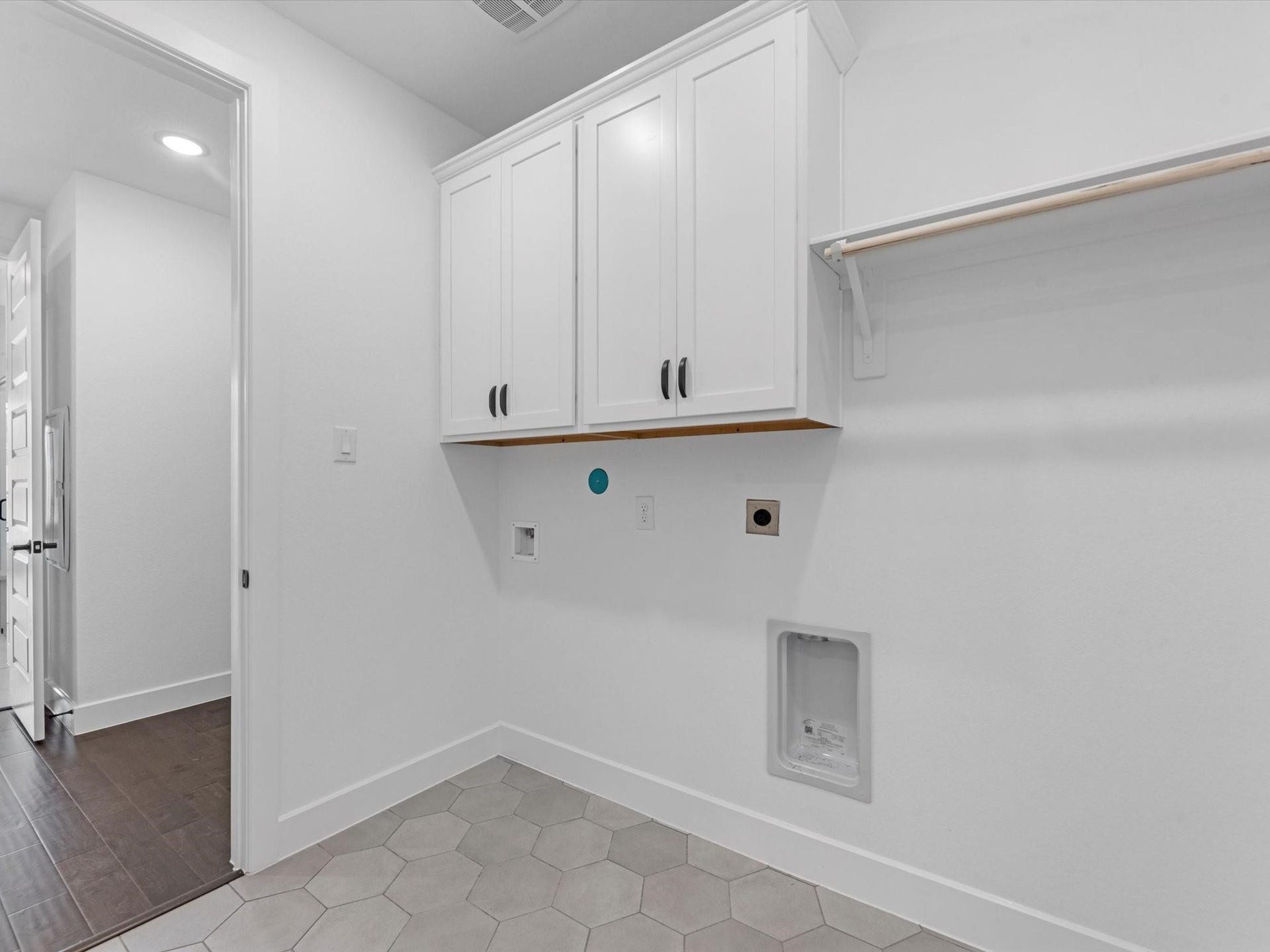 7307 Winding Aster Way, Katy, TX 77493 Laundry room with electric washer and dryer.