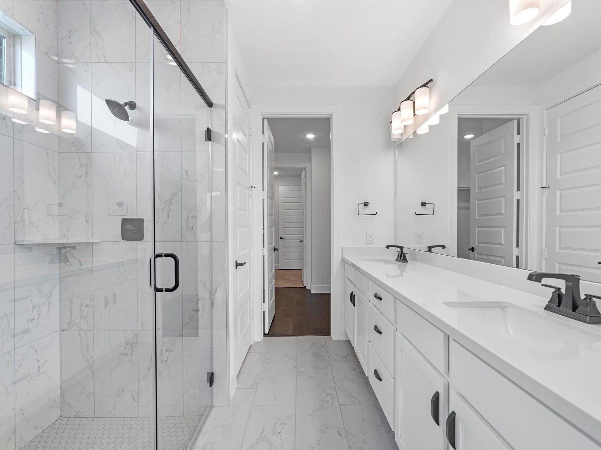 7307 Winding Aster Way, Katy, TX 77493 Master bathroom with custom tile upgrade all the way to the ceiling for the standing shower.