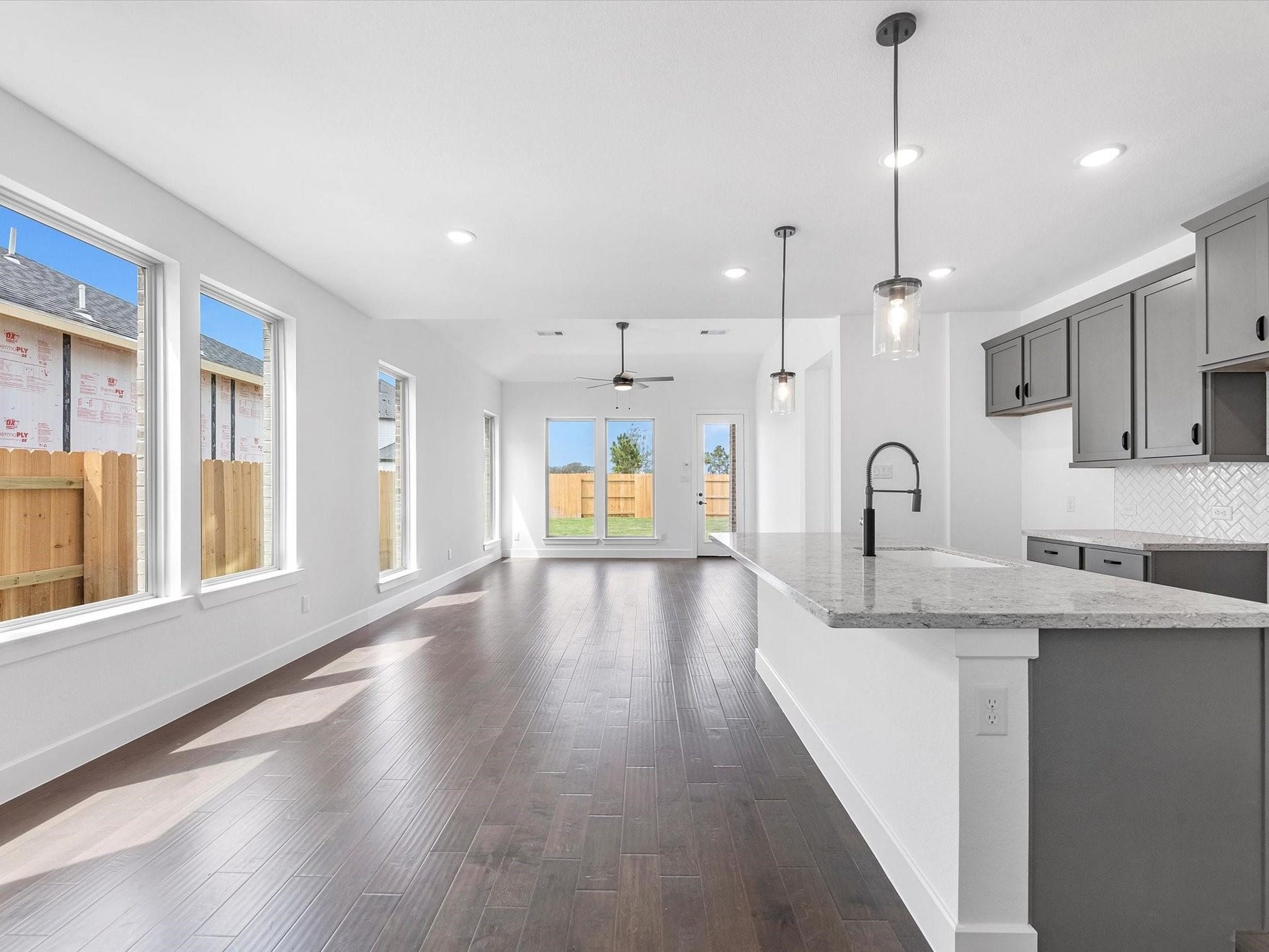7307 Winding Aster Way, Katy, TX 77493 Beautiful and open kitchen connect with family room and a lot big and high windows bring a lot of natural light lights to the first floor