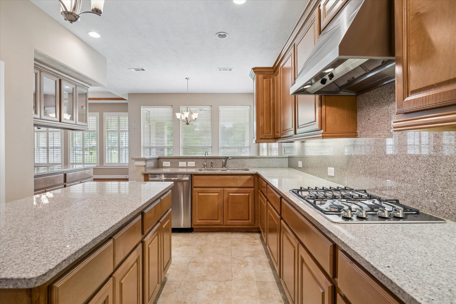 14407 Tivoli Drive, Houston, TX 77077 The island kitchen has plenty of counter space for the chef, as well as being open to the living area and breakfast room overlooking the backyard and lake