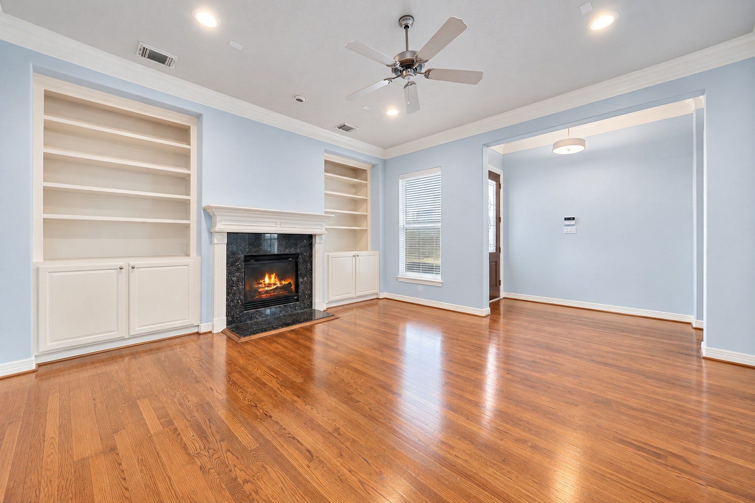 6309 Mapleridge Street, Houston, TX 77081 Spacious living room featuring a cozy gas-log fireplace