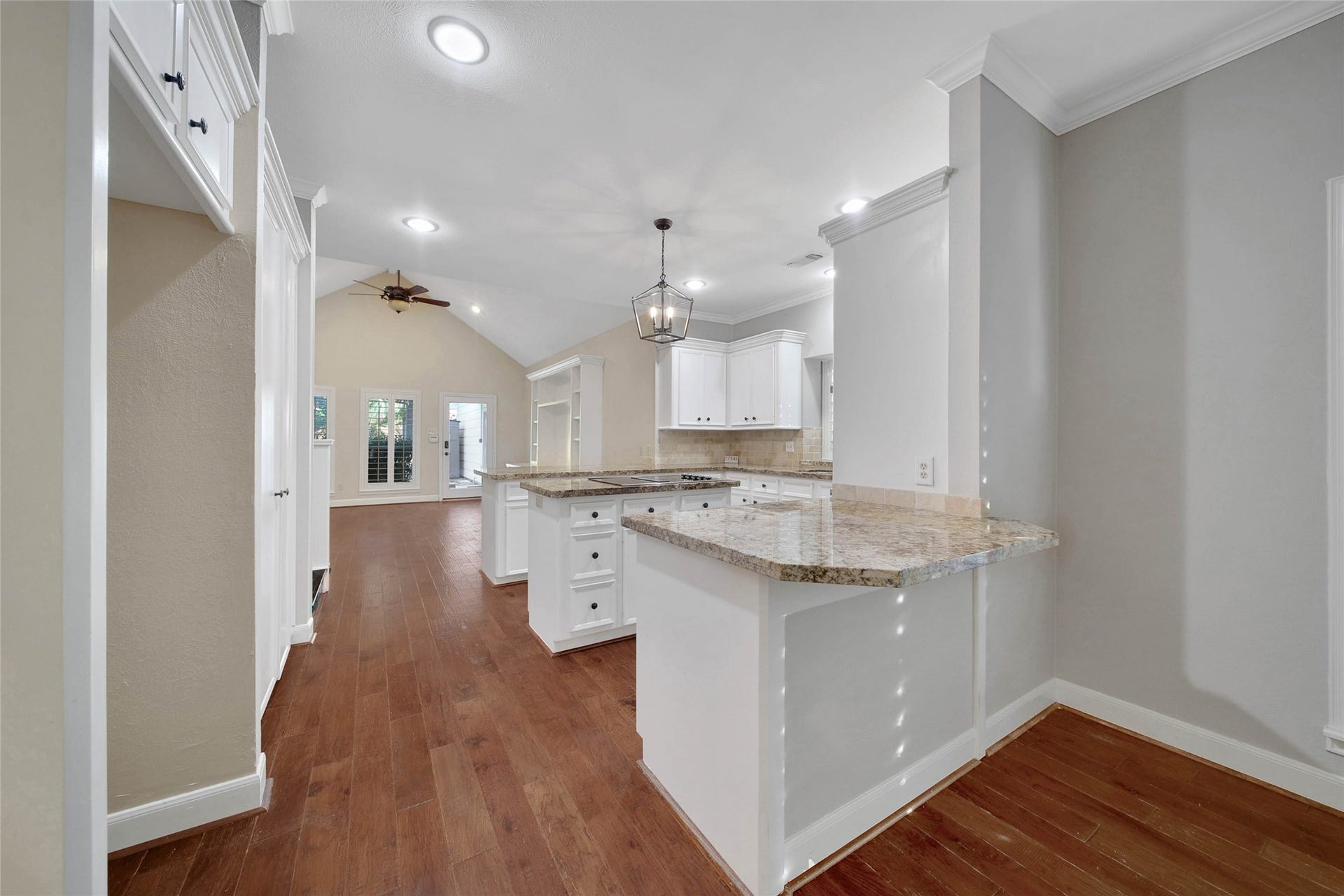 5814 Woodland Creek Drive, Kingwood, TX 77345 Functional kitchen features a double serving bar on each side of the kitchen.