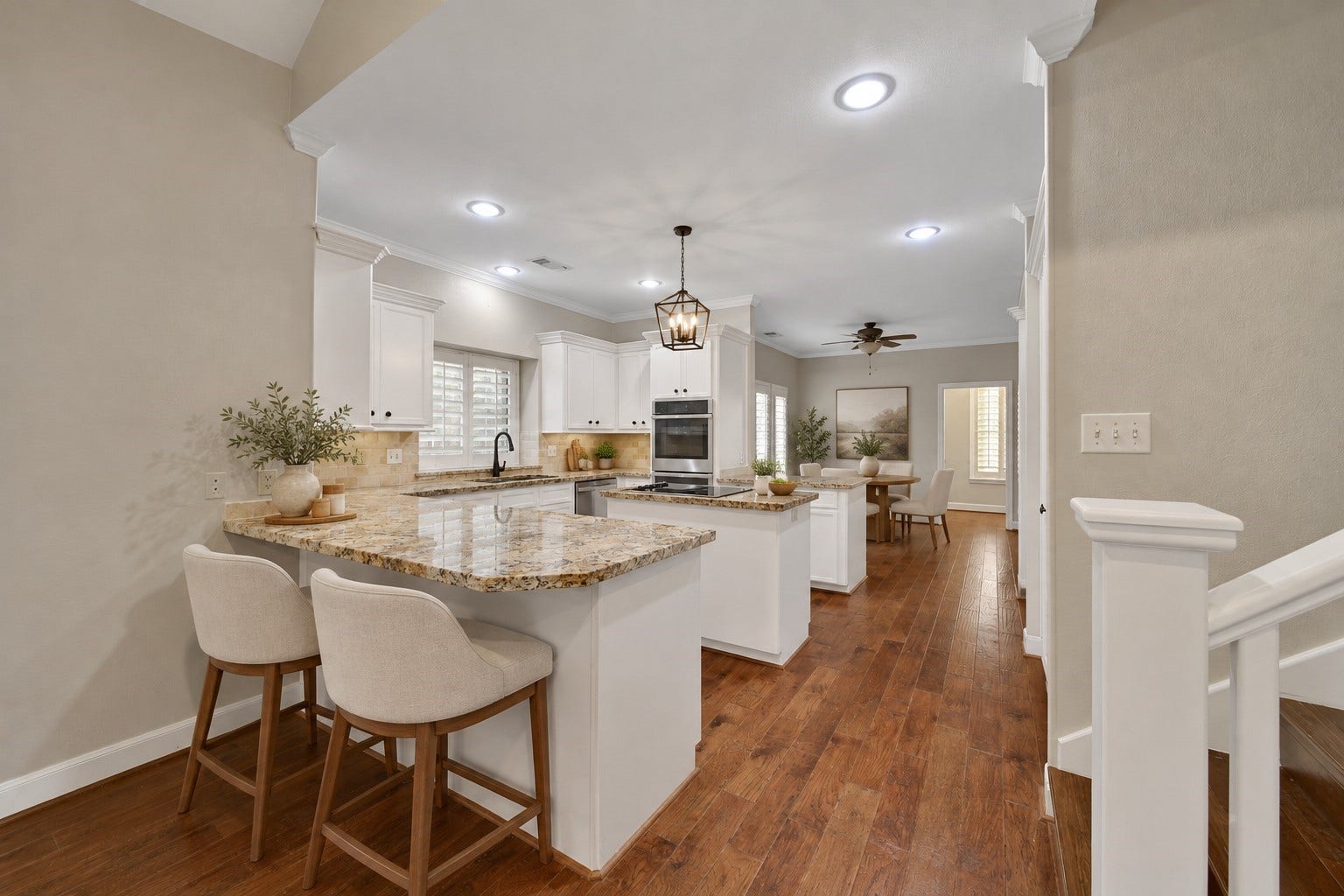 5814 Woodland Creek Drive, Kingwood, TX 77345 This functional kitchen serves it up, with two breakfast bars, and island cooktop, under and upper cabinet lighting, and custom built in pantry shelving, Multi-feature GE Profile double oven features convection cooking. GE Profile Dishwasher. Huge Breakfast room is adjacent to the kitchen with the butlers pantry / laundry utility room access. Photo has been digitally altered using generative ai for virtual staging. Buyer to verify all.