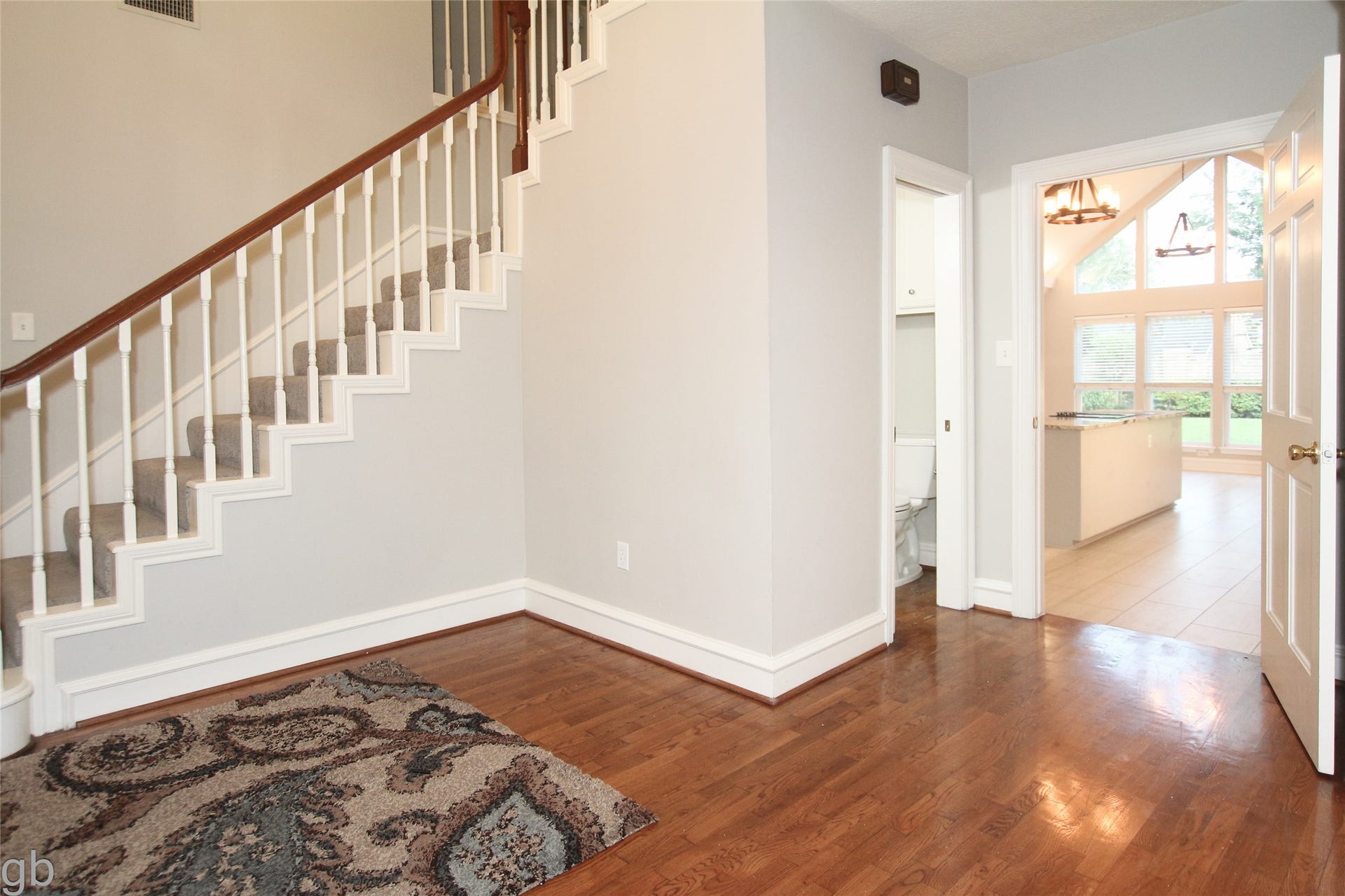 2918 Deer Creek Drive, Sugar Land, TX 77478 Foyer to Halfbath and Kitchen