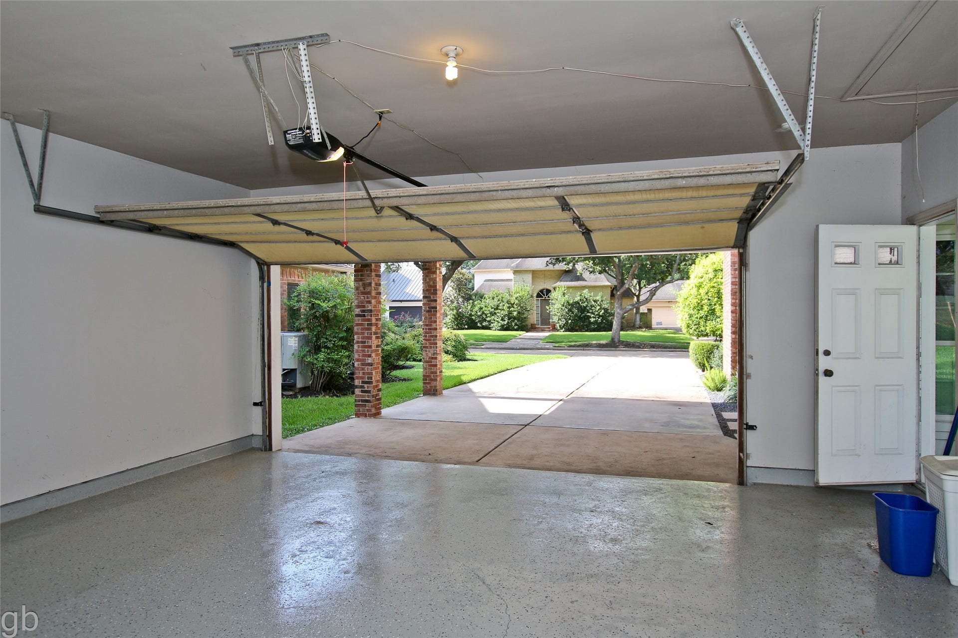 2918 Deer Creek Drive, Sugar Land, TX 77478 Inside garage looking towards street. Finished floor, insulated door, recent opener.