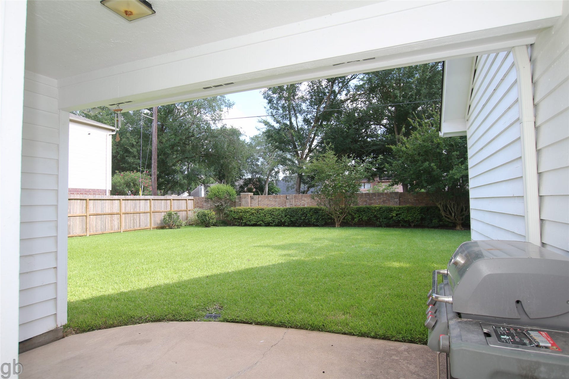 2918 Deer Creek Drive, Sugar Land, TX 77478 Back patio porch off kitchen and garage