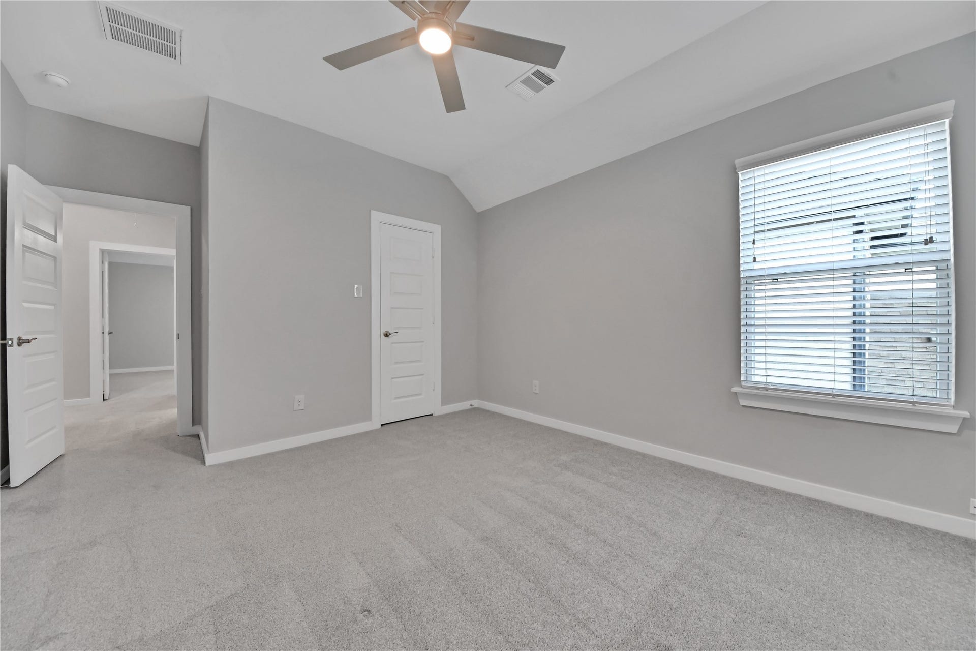 23619 Iris Field Court, Katy, TX 77493 Bedroom #2. Spacious secondary bedroom featuring a large closet, generous windows for abundant natural light, and plenty of room for comfortable everyday living.