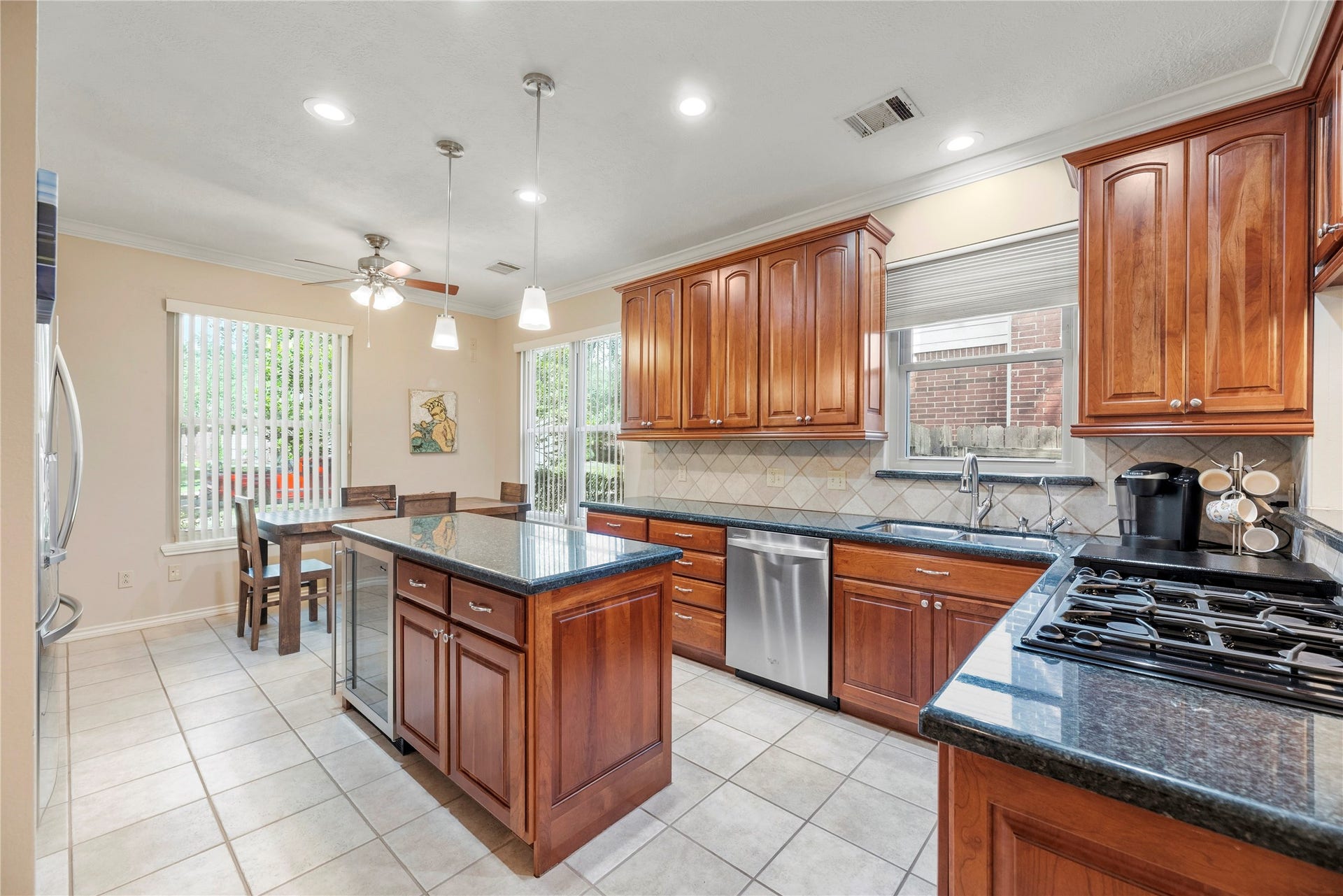 The large island includes a beverage refrigerator to keep those extra drinks cold.