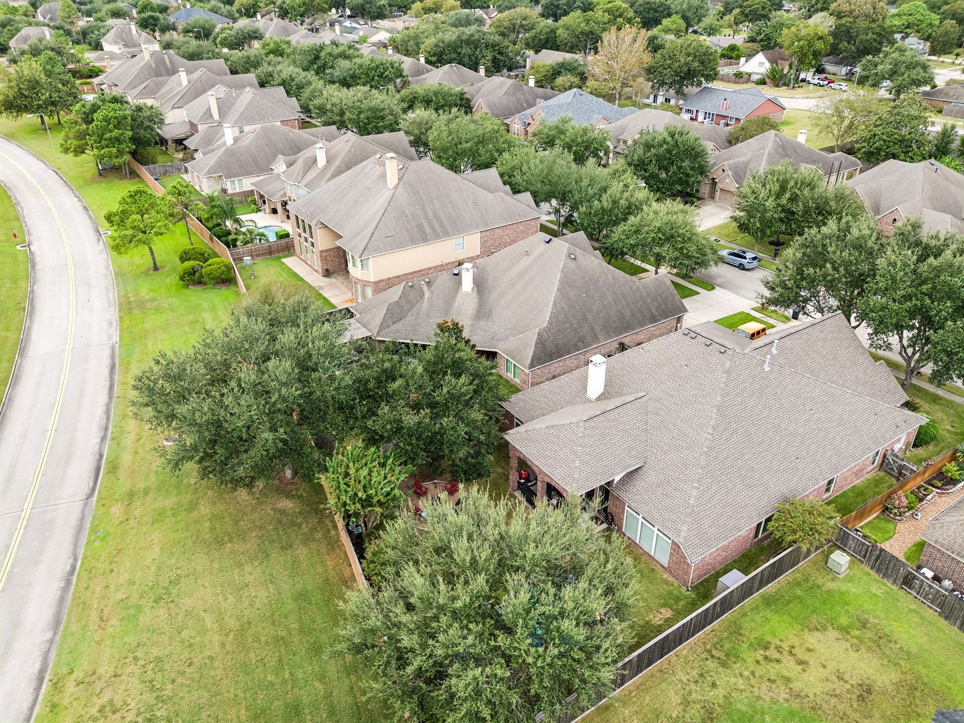 2927 Auburn Creek Lane, League City, TX 77573 Aerial view showing the home, lot, mature landscaping, and surrounding neighborhood setting.