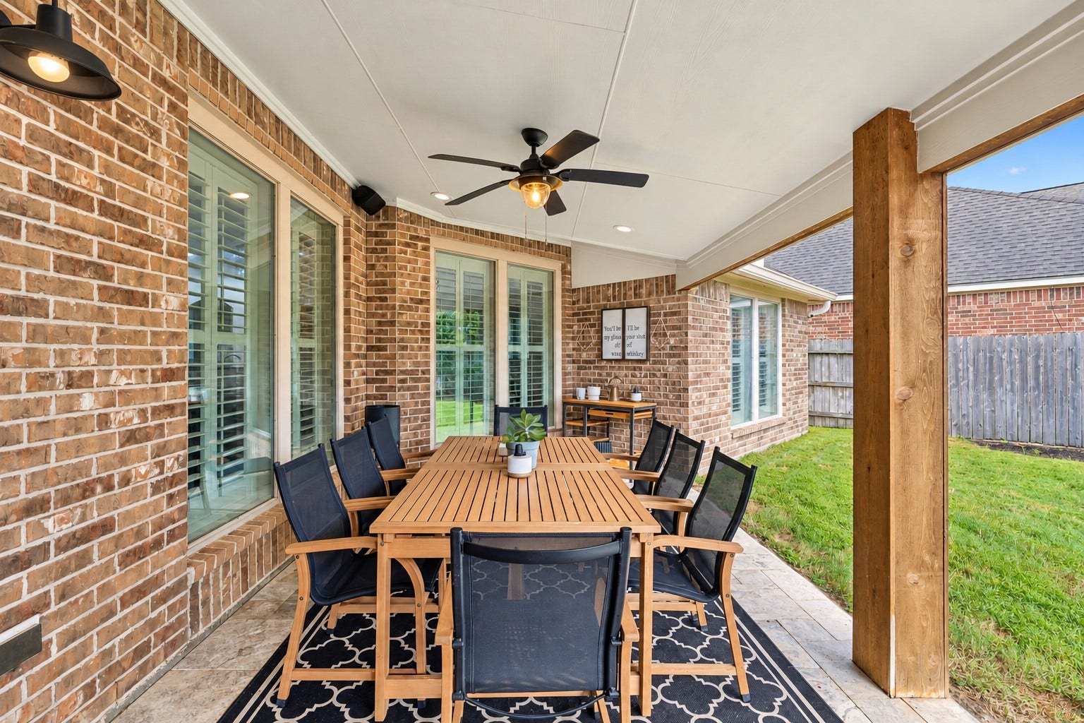 2927 Auburn Creek Lane, League City, TX 77573 Covered patio with ceiling fan and ample space for outdoor dining, relaxing, or entertaining.