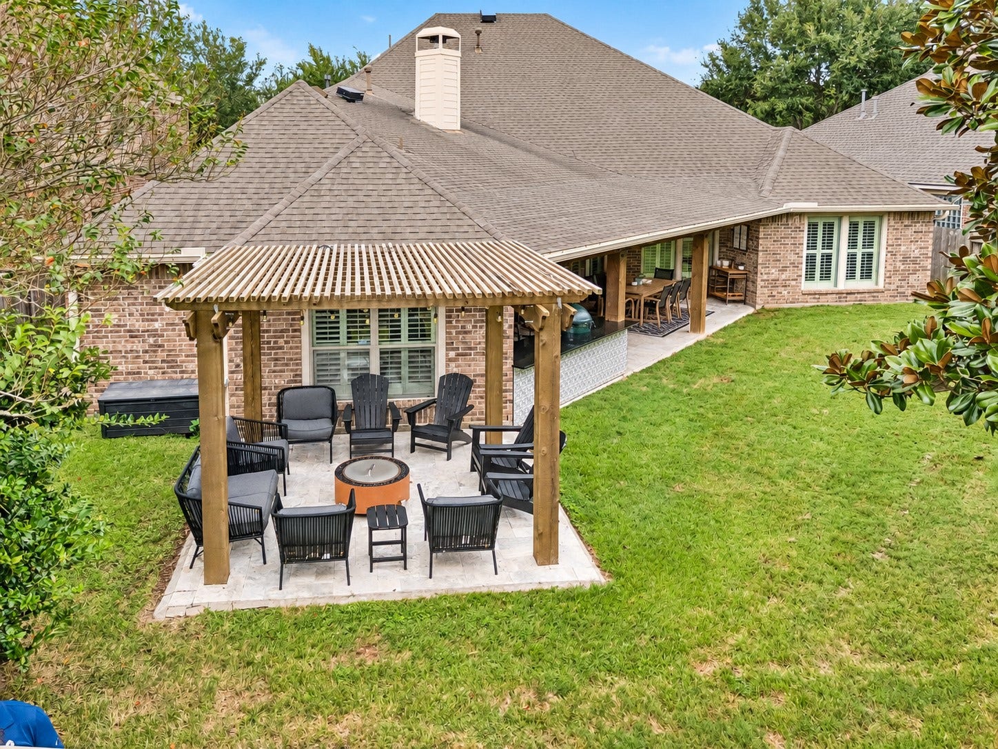 2927 Auburn Creek Lane, League City, TX 77573 Elevated rear view highlighting the covered outdoor living area and expansive lawn.