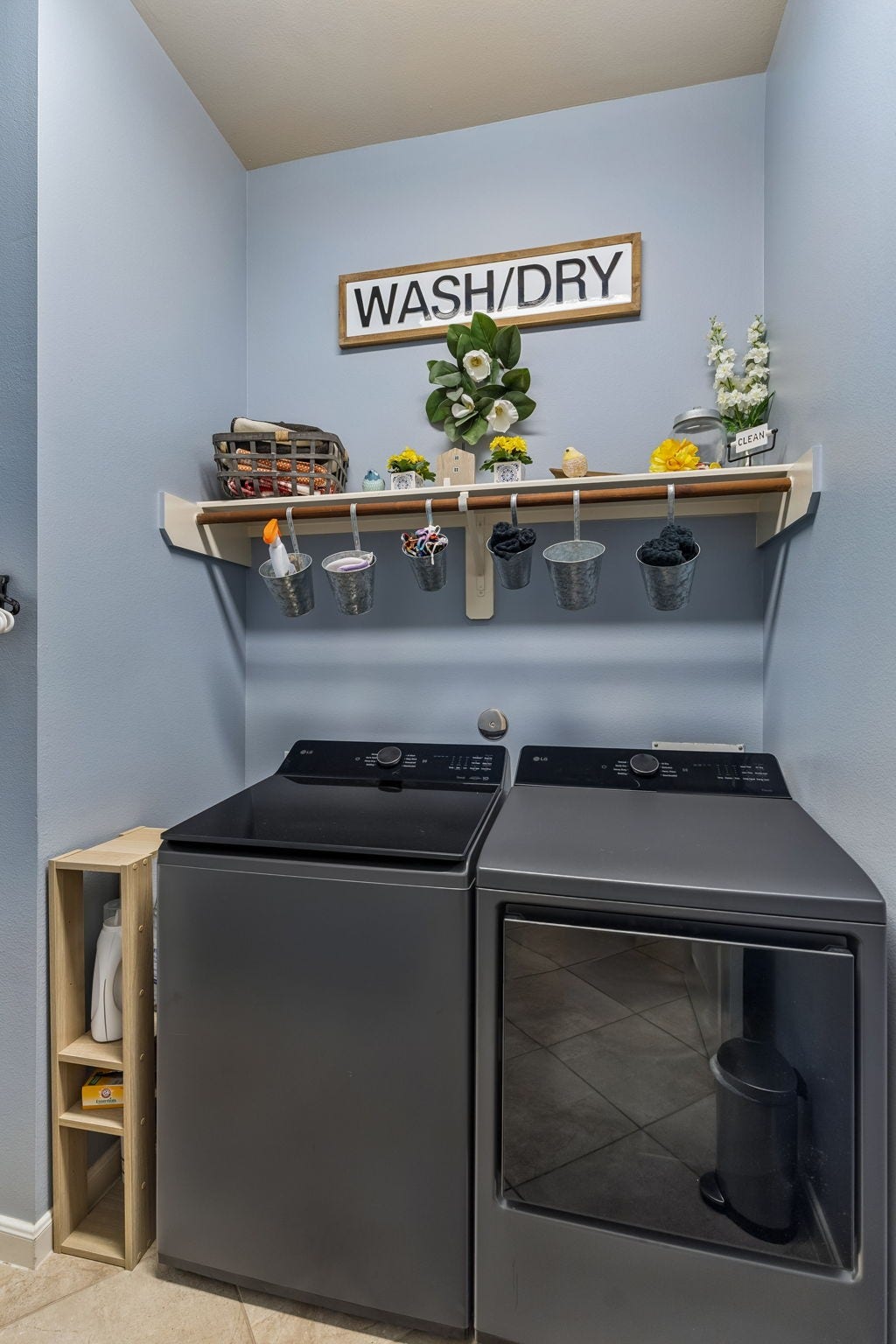 2927 Auburn Creek Lane, League City, TX 77573 Dedicated laundry area with full-size washer and dryer, overhead shelving, and convenient storage space.