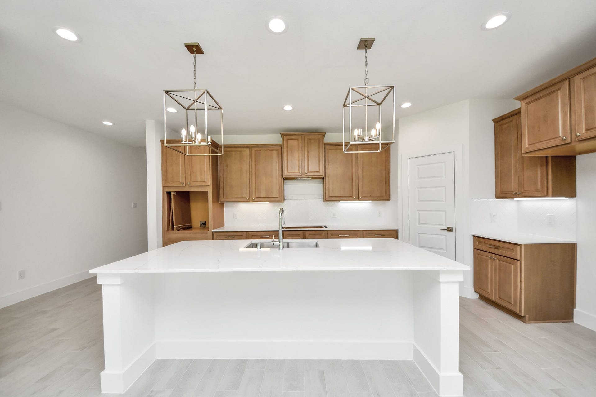 3217 Skerne Spring Drive, Spring, TX 77373 This kitchen is by far any chefs dream! This spacious kitchen features high ceilings, stained wood cabinets, granite countertop, SS appliances, modern tile backsplash, recessed lighting, extended counter space, granite kitchen island with double sink, and space for breakfast bar, and a walk-in pantry all overlooking your huge family room. Sample photo of completed home with similar floor plan. Actual colors and selections may vary.