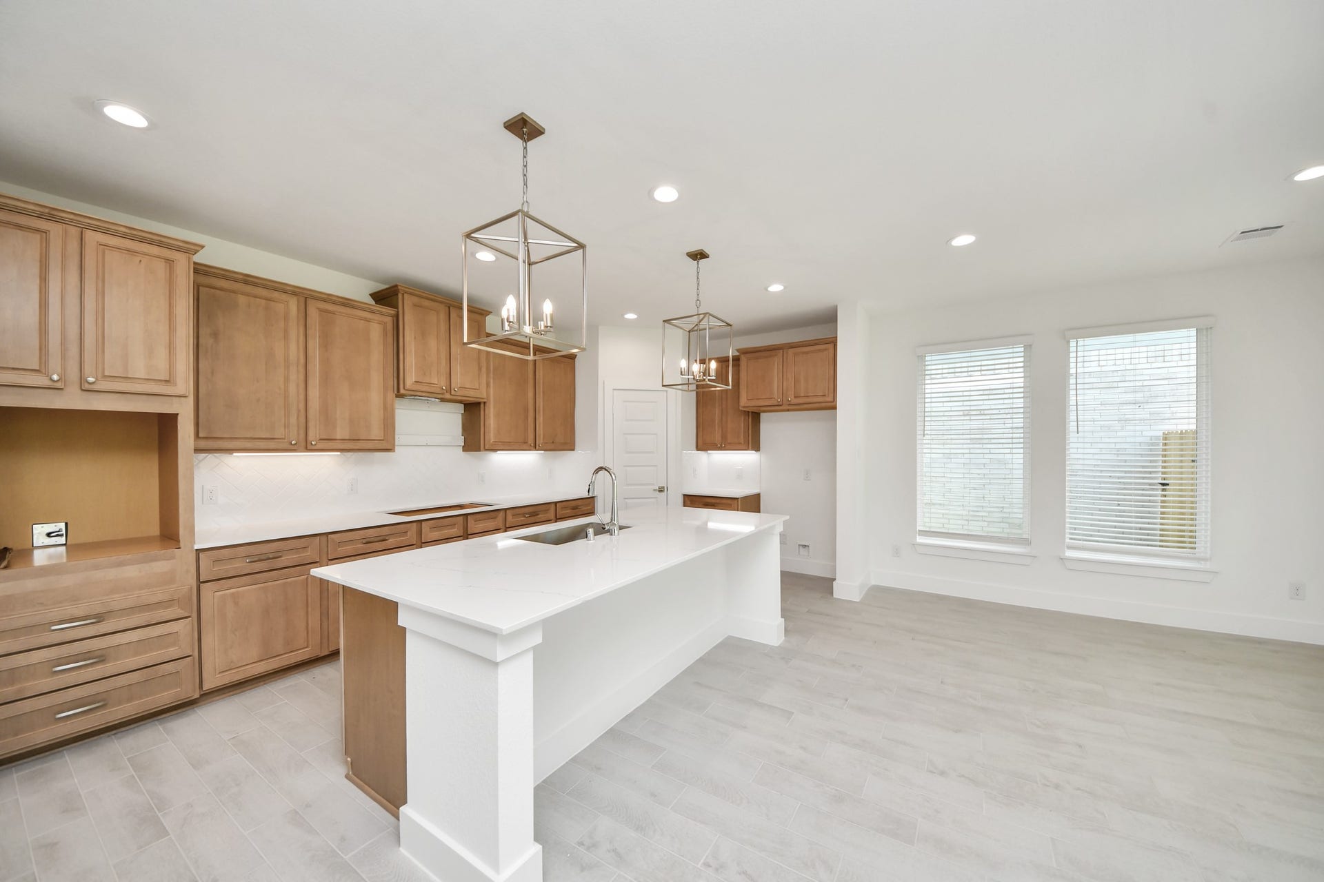 3217 Skerne Spring Drive, Spring, TX 77373 The kitchen is a culinary haven, featuring granite countertops, a tile backsplash, stainless steel appliances, 42 upper cabinets, and undercabinet lighting. Sample photo of completed home with similar floor plan. Actual colors and selections may vary.