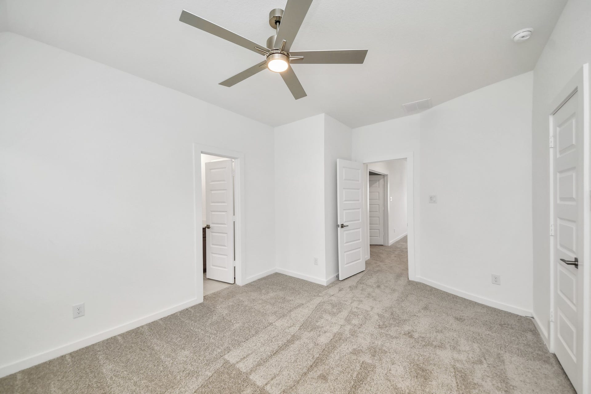 3217 Skerne Spring Drive, Spring, TX 77373 Secondary bedroom features plush carpeting, large windows that let in plenty of natural light, bright paint, and spacious closets. Sample photo of completed home with similar floor plan. Actual colors and selections may vary.