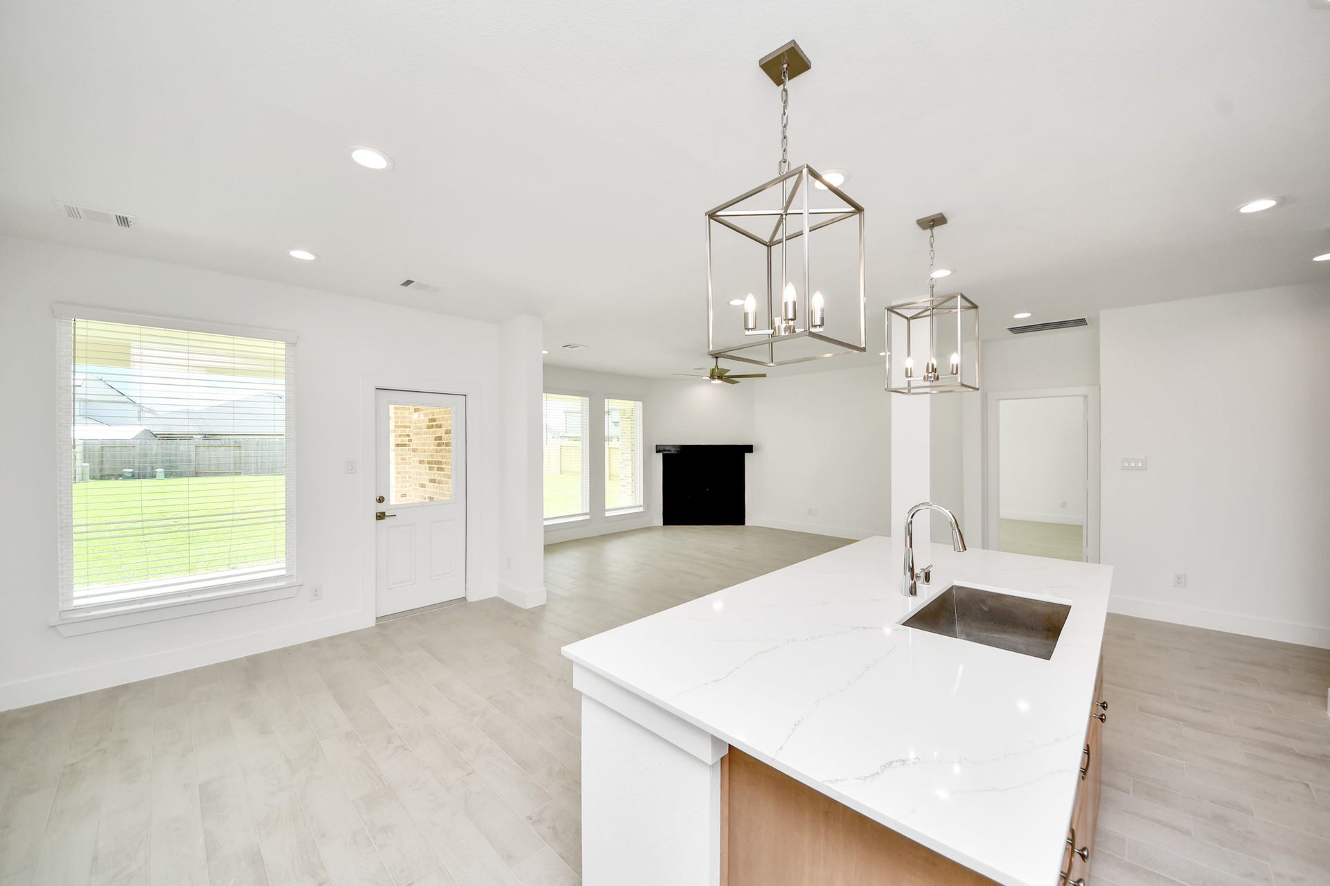 3217 Skerne Spring Drive, Spring, TX 77373 The open concept effortlessly connects the kitchen to the expansive family room, forming a perfect hub for gatherings. This seamless flow creates an inviting space where cooking and socializing come together harmoniously. Sample photo of completed home with similar floor plan. Actual colors and selections may vary.