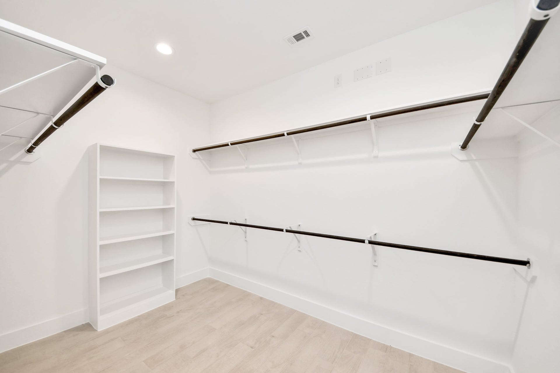 3217 Skerne Spring Drive, Spring, TX 77373 Walk-in closet that epitomizes luxury and practicality. This generously sized space features built-in shelving, offering abundant room for impeccable organization. High ceilings and recessed lighting create a bright and welcoming ambiance. Sample photo of completed home with similar floor plan. Actual colors and selections may vary.