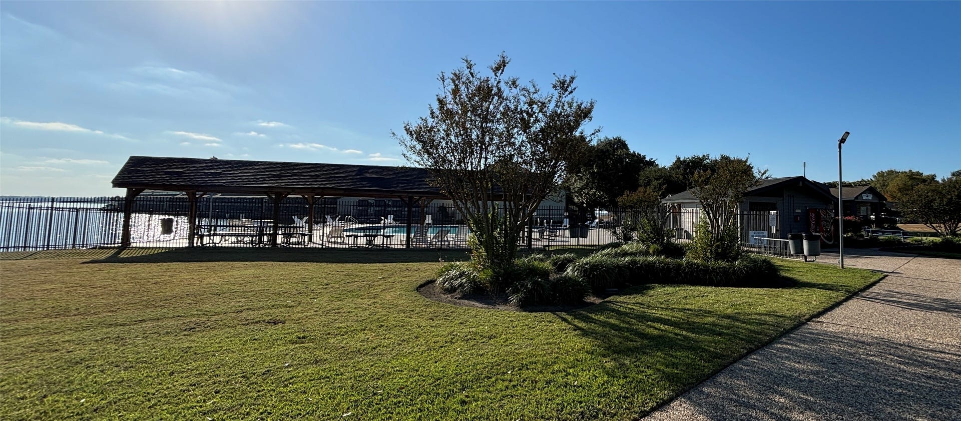 6894 Stillwater Drive, Willis, TX 77318 A community pool overlooking Lake Conroe - can it get much better?