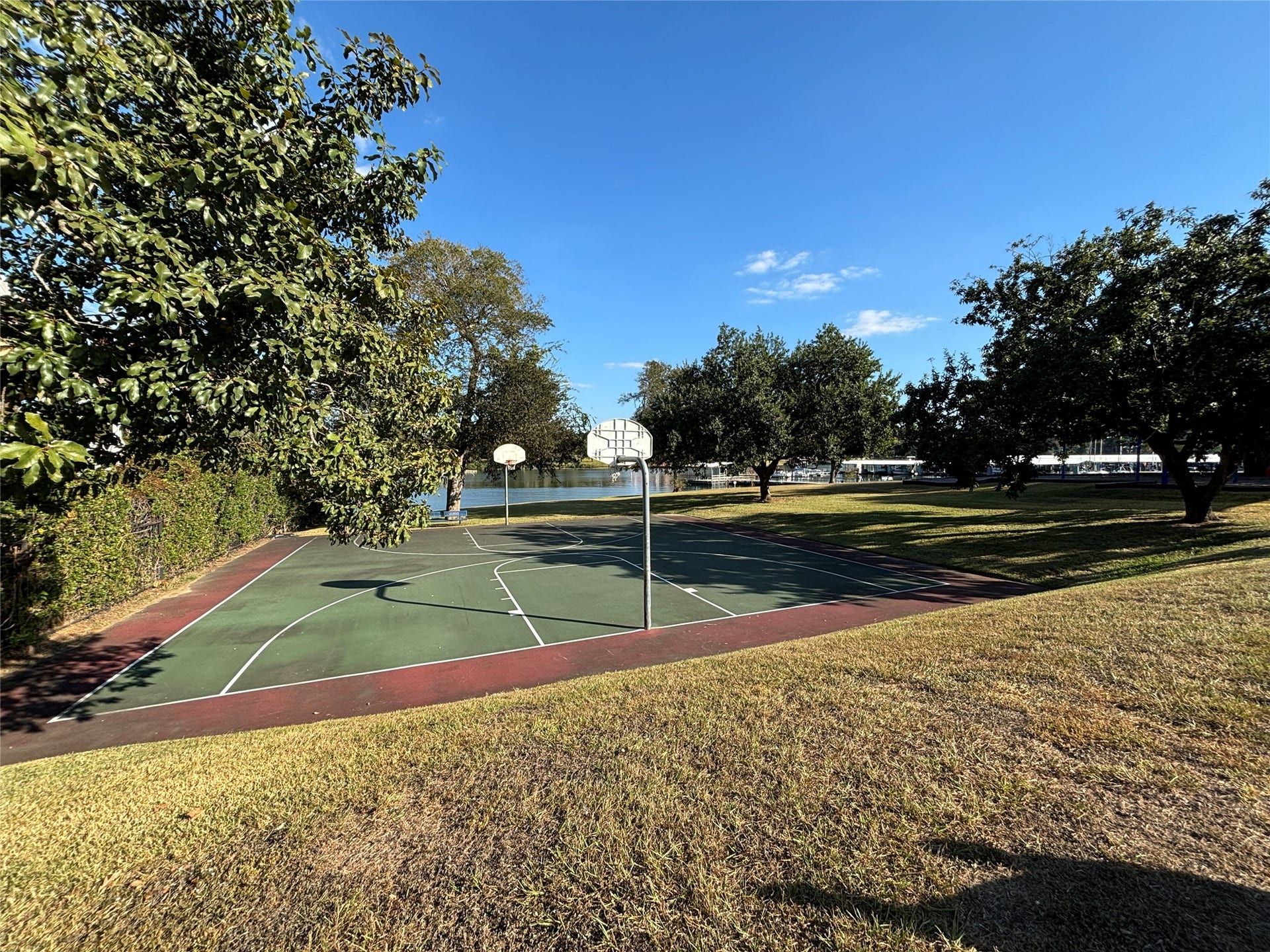 6894 Stillwater Drive, Willis, TX 77318 Basketball and Pickleball courts offer even more ways to enjoy living in Seven Coves