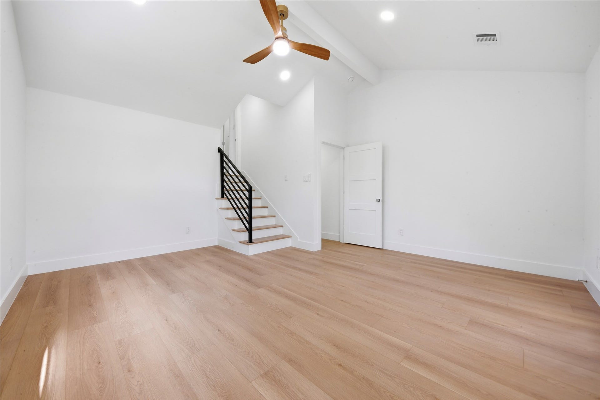 40203 Cimarron Way, Magnolia, TX 77354 Soaring vaulted second primary suite with private interior staircase leading up to the dedicated fourth-floor ensuite bath and walk-in closet. Wide-plank floors and abundant natural light throughout.