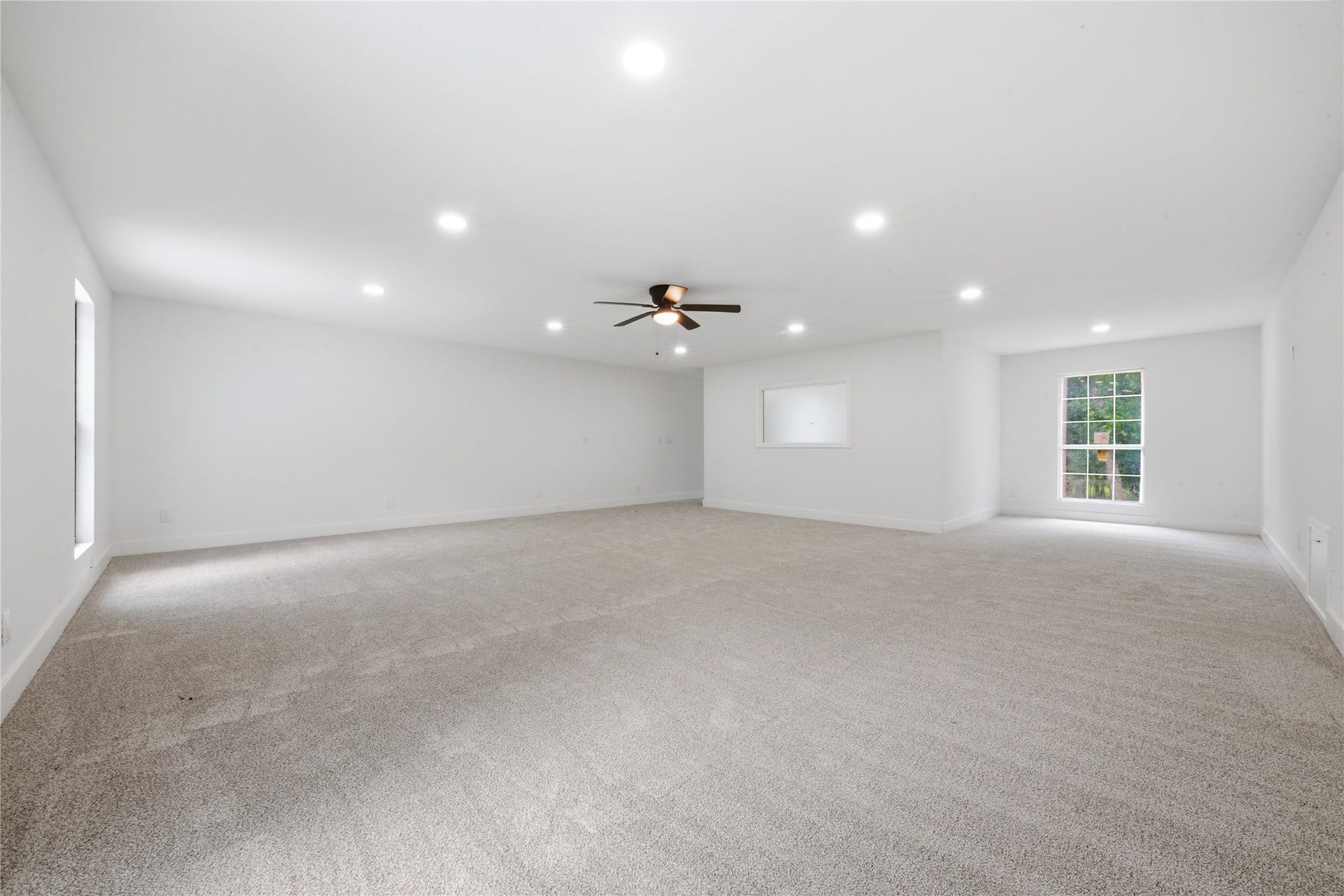 40203 Cimarron Way, Magnolia, TX 77354 Second view of the upper-floor detached suite showing the impressive scale, multiple windows for natural light, and white grid-pattern accent window. Endless possibilities, private retreat, in-law suite, podcast studio, or income-producing space.