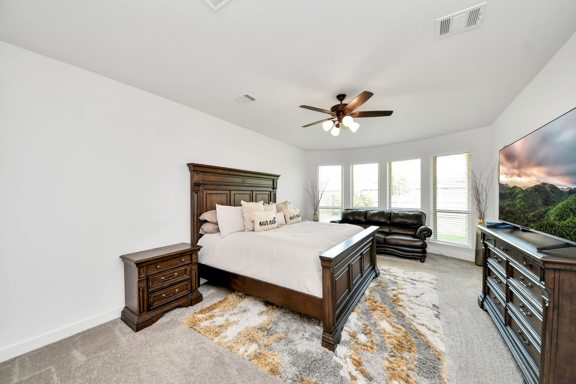Spacious primary bedroom with abundant natural light.