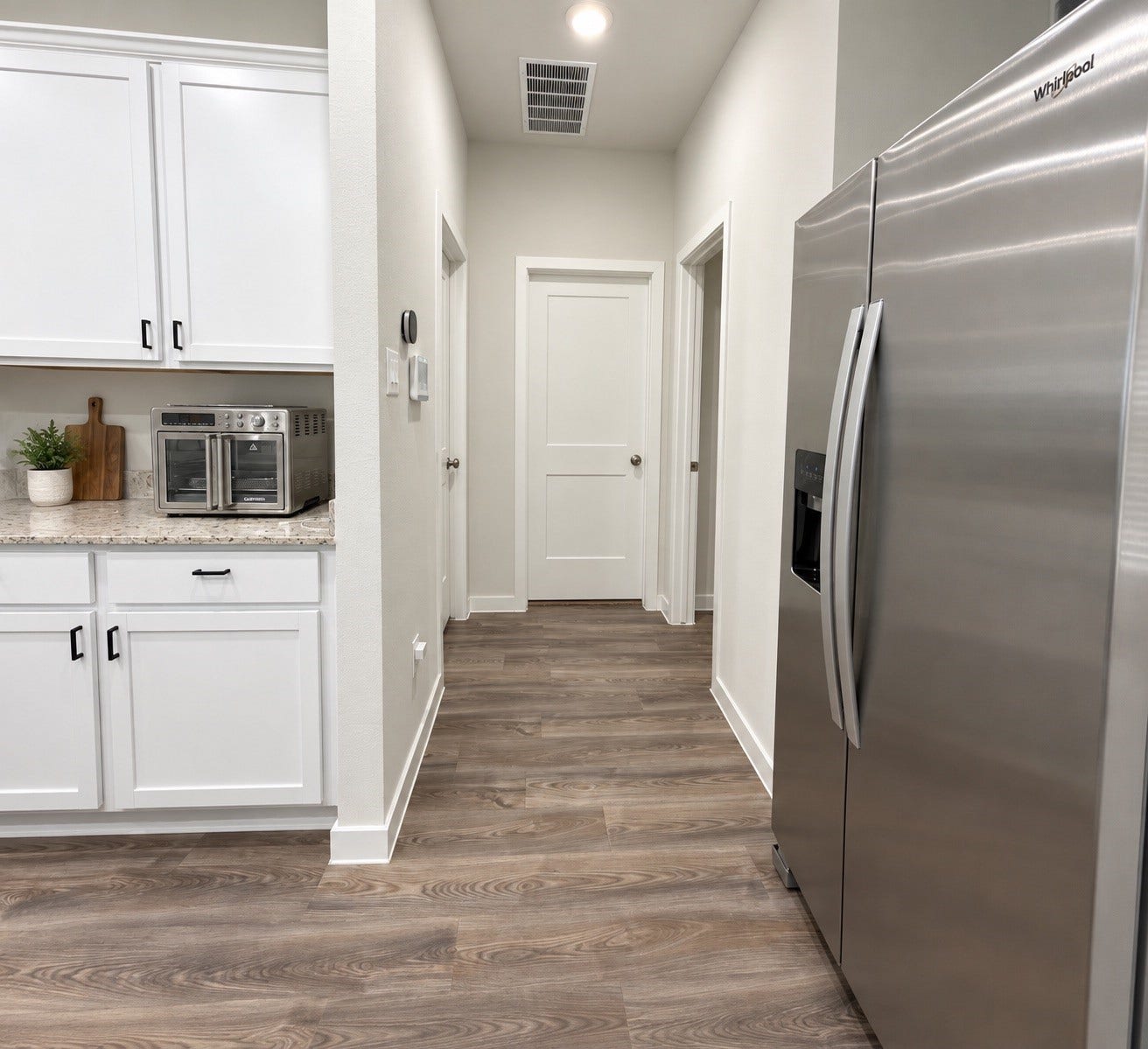 Kitchen with Convenient Access to Additional Rooms