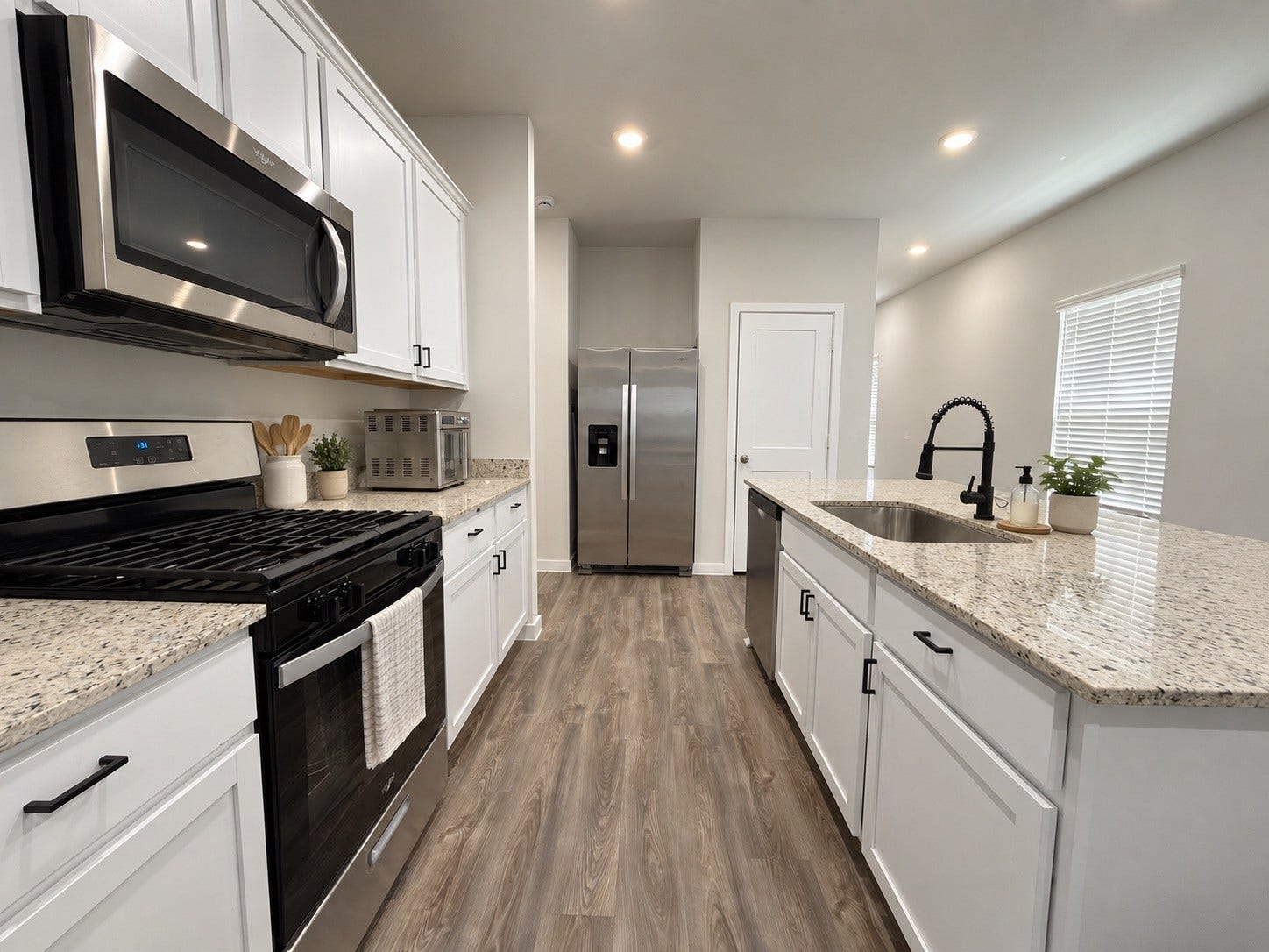 Kitchen with Granite Countertops and Stainless Steel Appliances