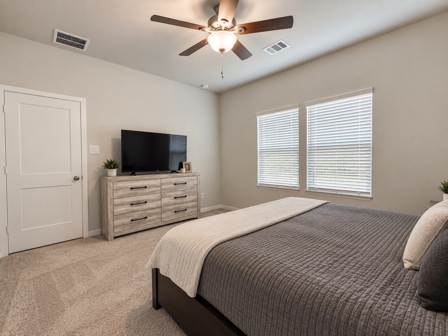 Spacious Primary Bedroom with Ceiling Fan