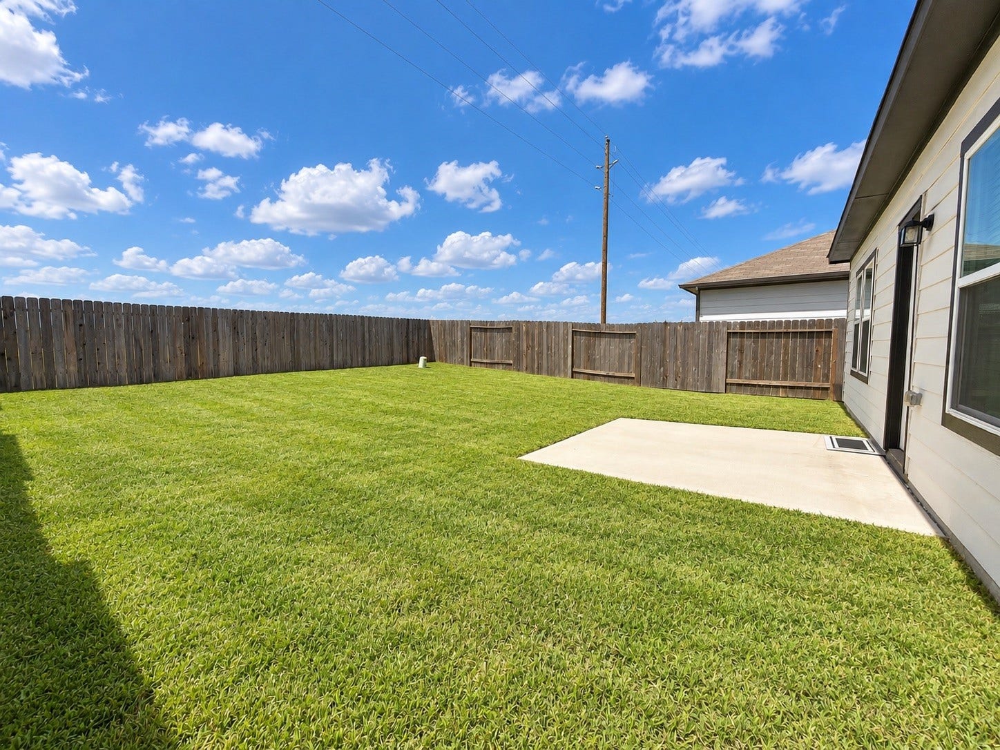 Fully Fenced Backyard with Open Green Space