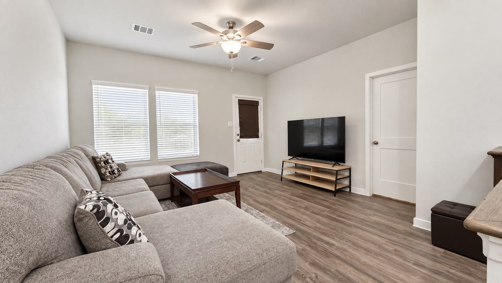 Spacious Living Room with Natural Light and Open-Concept Layout