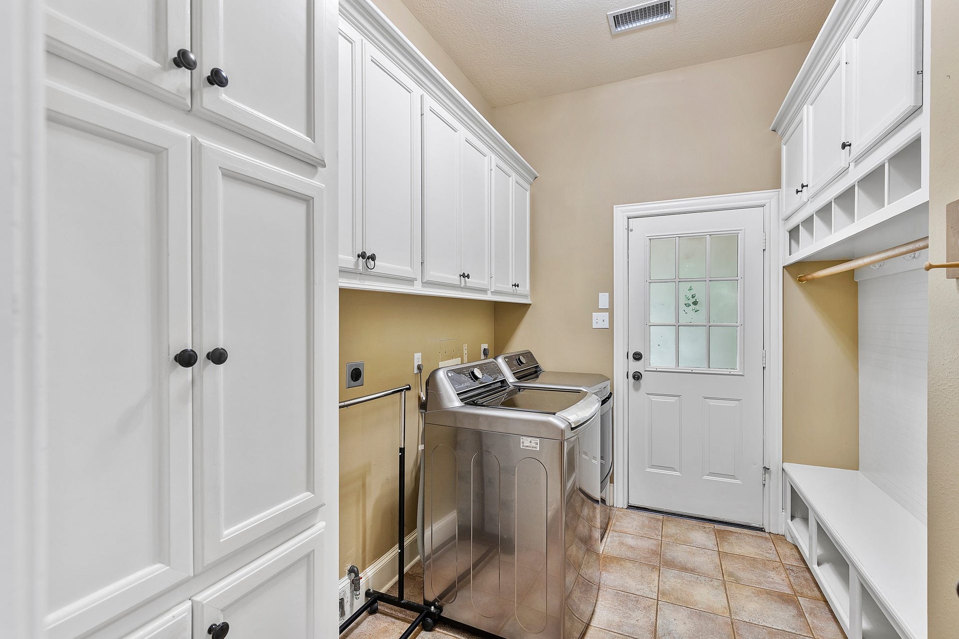 74 W Thymewood Place, The Woodlands, TX 77382 Utility Room with drop station and custom built-ins