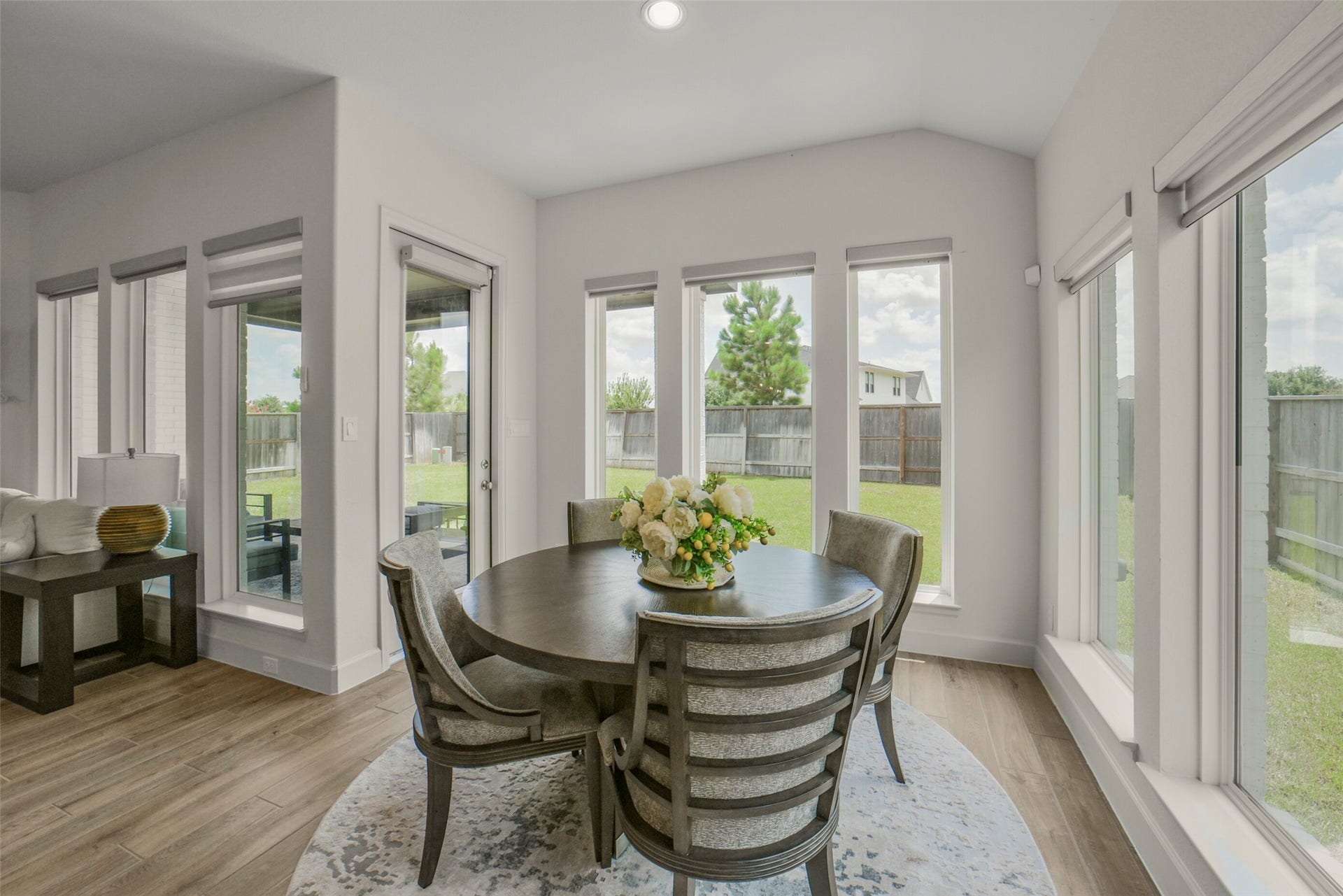 Large windows provide bright views of the backyard.