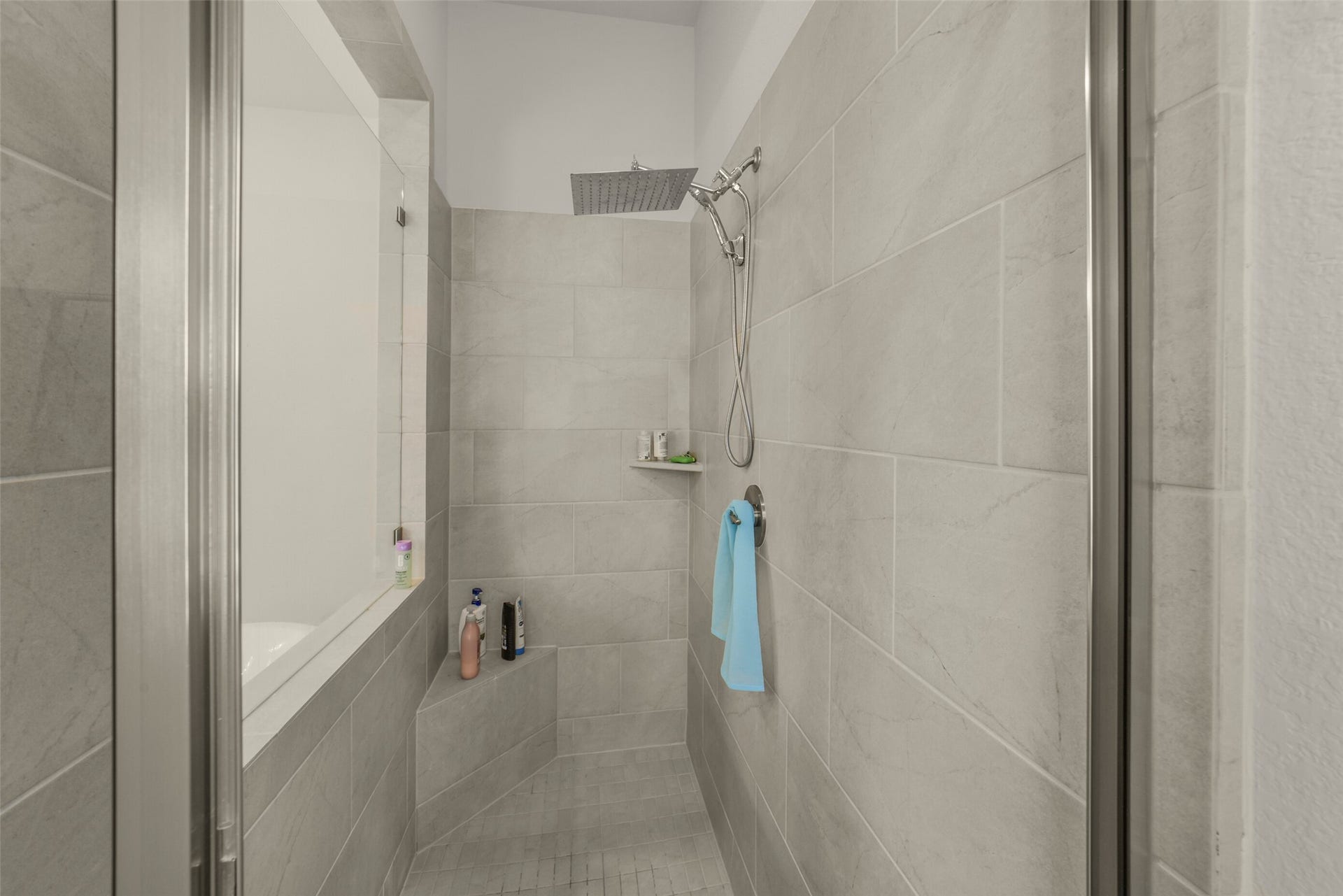 Oversized walk in shower with modern finishes.