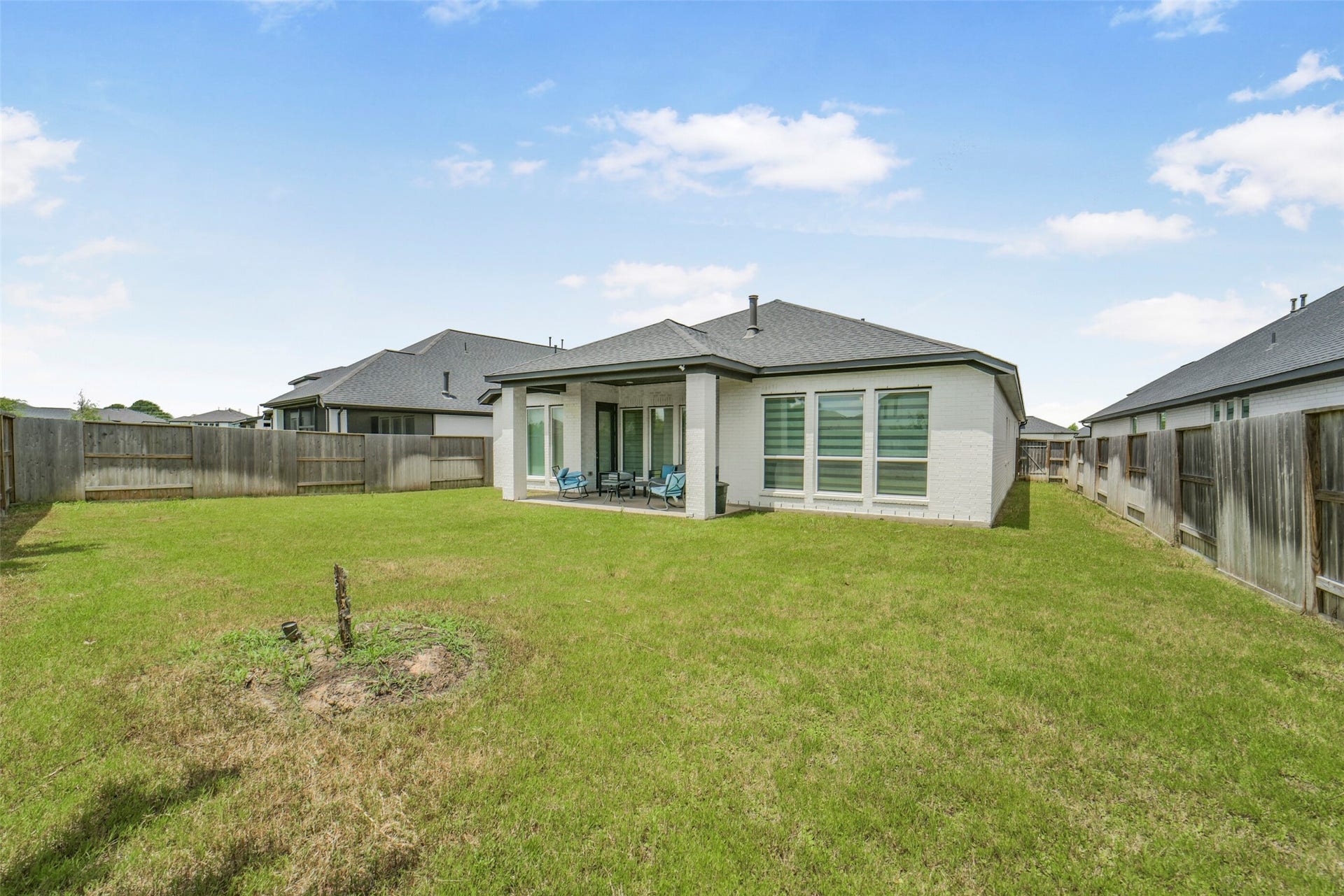 Large backyard offers endless possibilities for outdoor enjoyment.