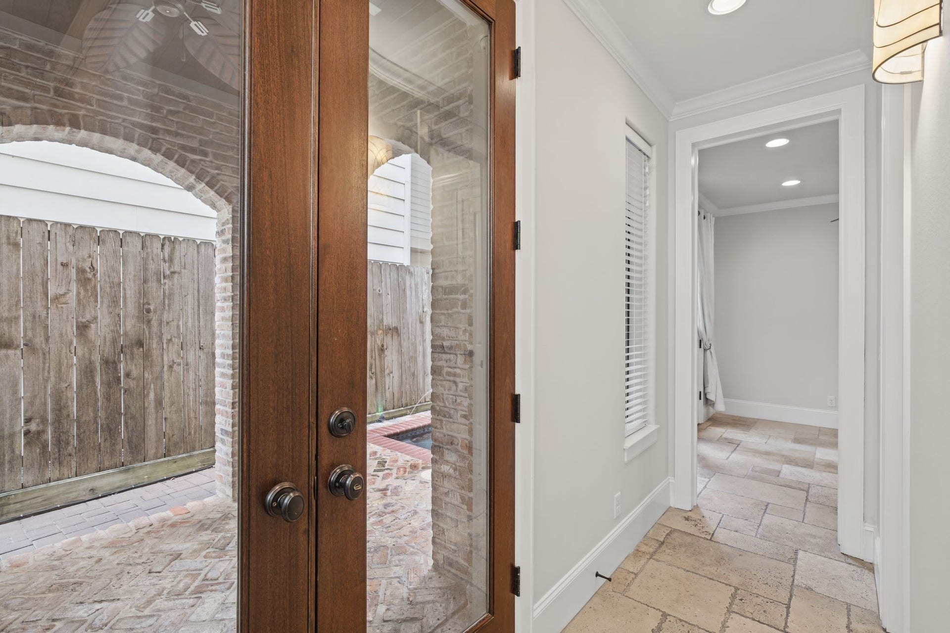 4122 Floyd Street, #A, Houston, TX 77007 Foyer | French Doors First Floor Elegant, clear-glass French doors invite natural light into the foyer while offering a beautiful transition to the summer kitchen, where indoor comfort gives way to the pleasures of outdoor living.