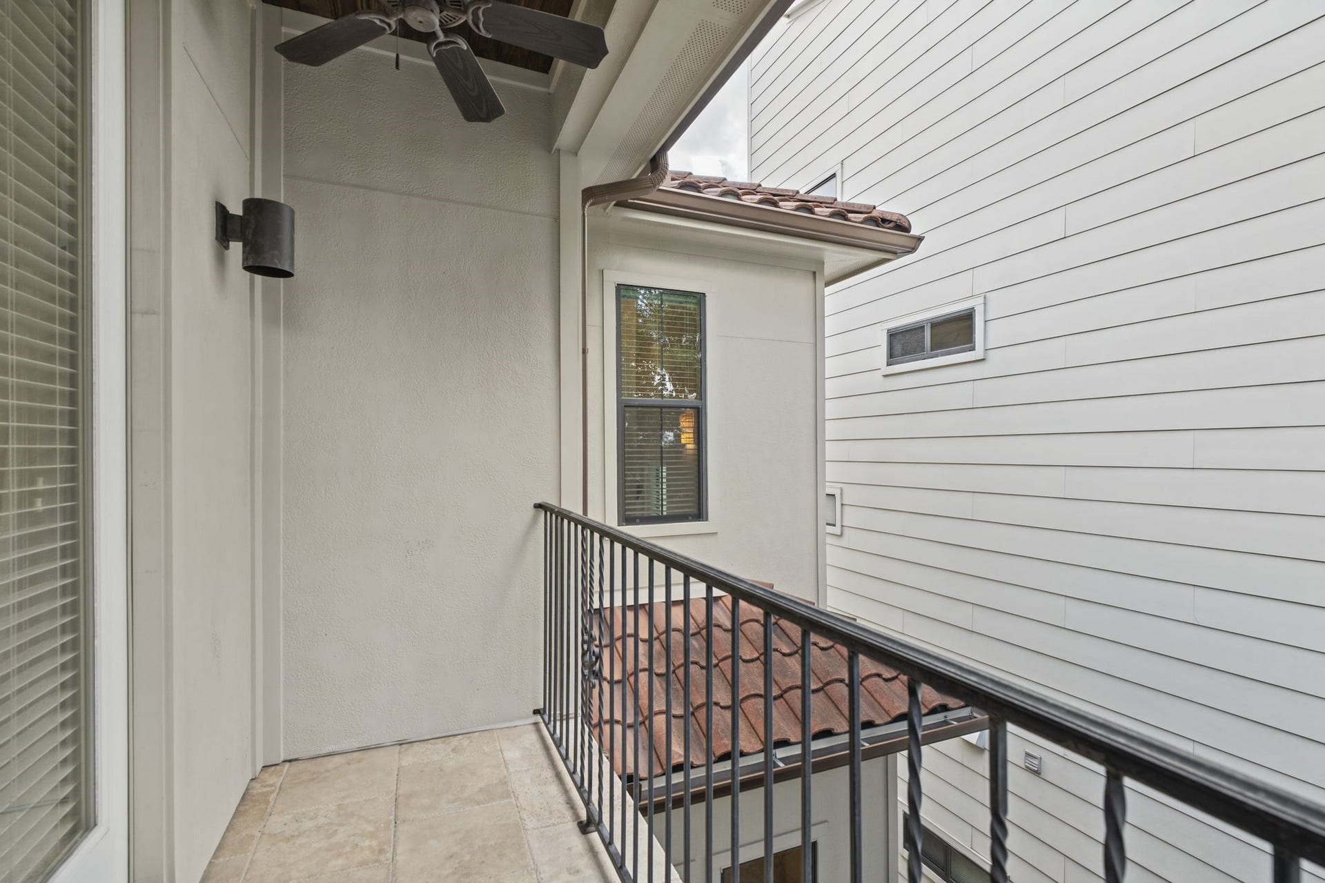 Primary Balcony [5 x 12]  Third Floor. An extension of the primary suite, this elevated outdoor retreat invites leisurely mornings with coffee or a peaceful evening overlooking the courtyard below.