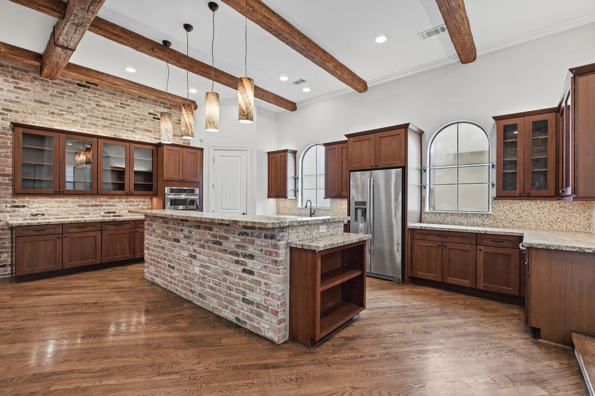 4122 Floyd Street, #A, Houston, TX 77007 Kitchen | Breakfast Bar Second Floor A welcoming extension of the kitchen island, this elevated breakfast bar offers the perfect perch for morning coffee, casual dining, or conversation with the chef.