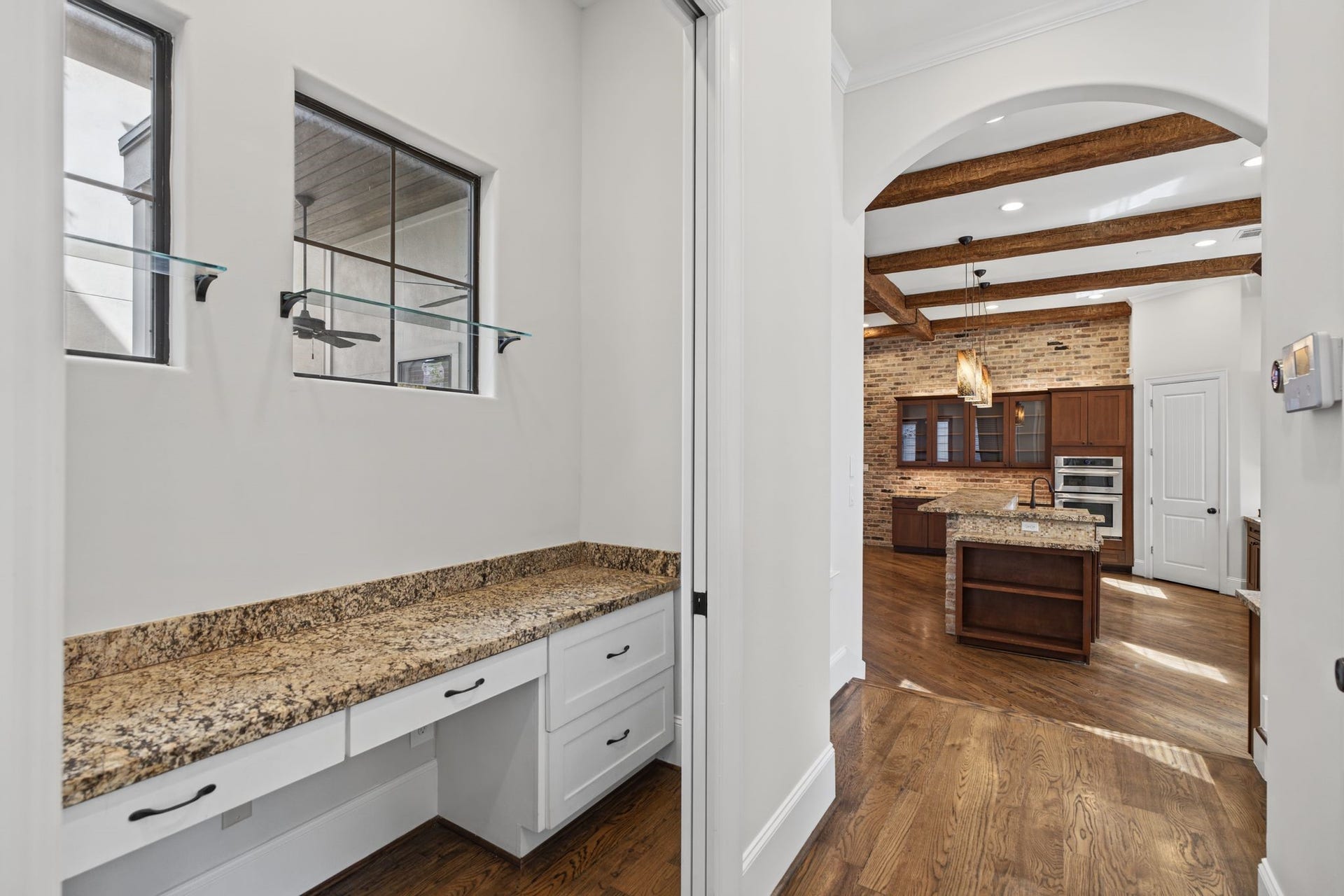 4122 Floyd Street, #A, Houston, TX 77007 Workstation Second Floor. Framed by two windows that welcome natural light, this thoughtfully integrated built-in desk creates an inviting space for working from home, managing daily affairs, or finding a quiet moment of productivity.