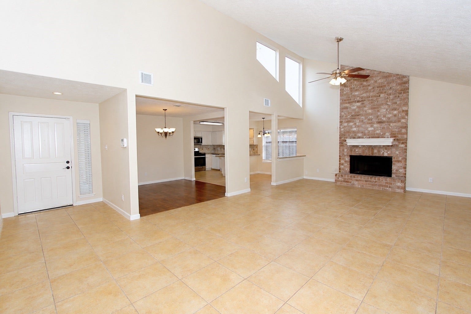 2731 Colony Drive, Sugar Land, TX 77479 Alternate view of the living room, showing the open-concept layout overlooking the kitchen and dining room entrance