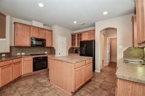 21502 Venture Park Drive, Richmond, TX 77406 Kitchen with an island and ample storage