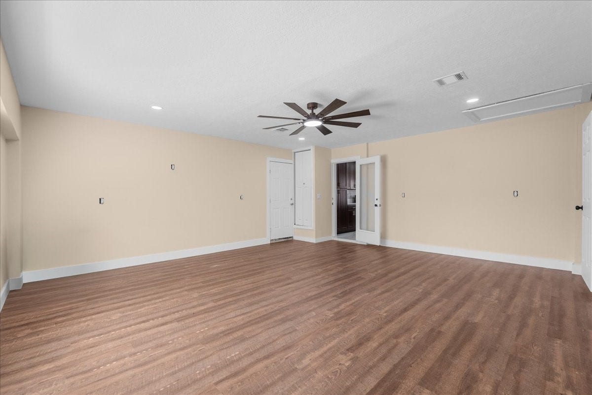 11007 Green Arbor Drive, Houston, TX 77089 Flex Room with wood like flooring , and rear door going to back yard and glass door to kitchen
