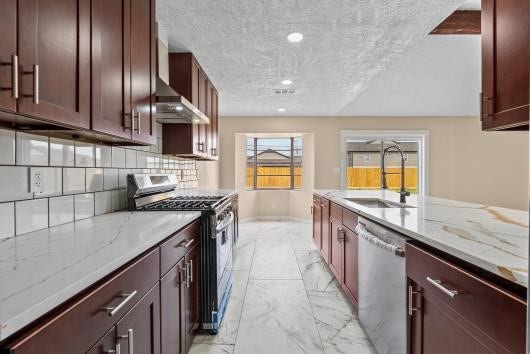 11007 Green Arbor Drive, Houston, TX 77089 This spacious kitchen features a stylish, modern backsplash, large windows allowing much natural light.