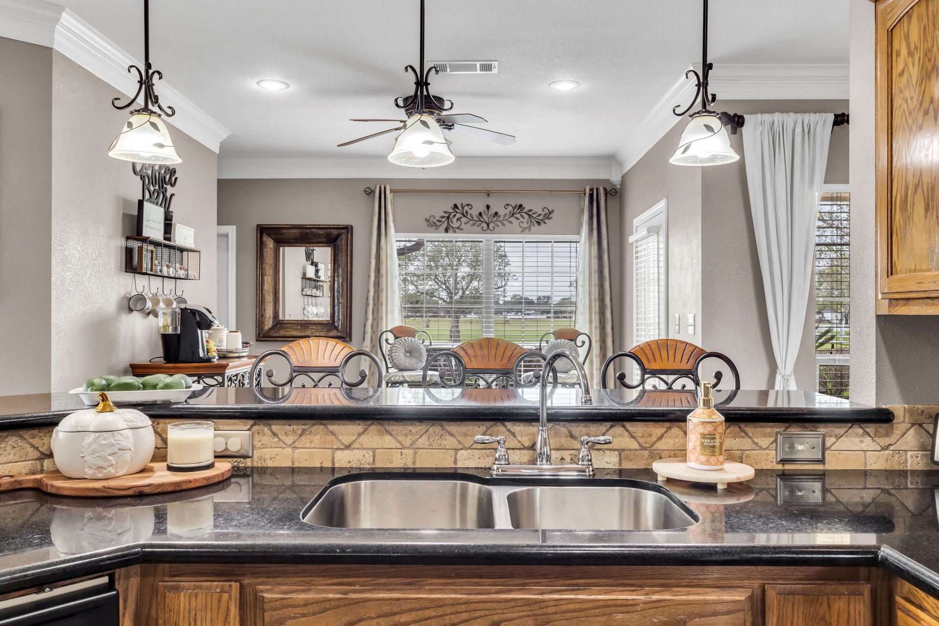 11010 Madison Court, Beaumont, TX 77705 Bright breakfast area with a dedicated space currently used as a coffee bar, offering a cozy spot to enjoy your morning coffee. Large windows bring in natural light and provide views of the outdoors.