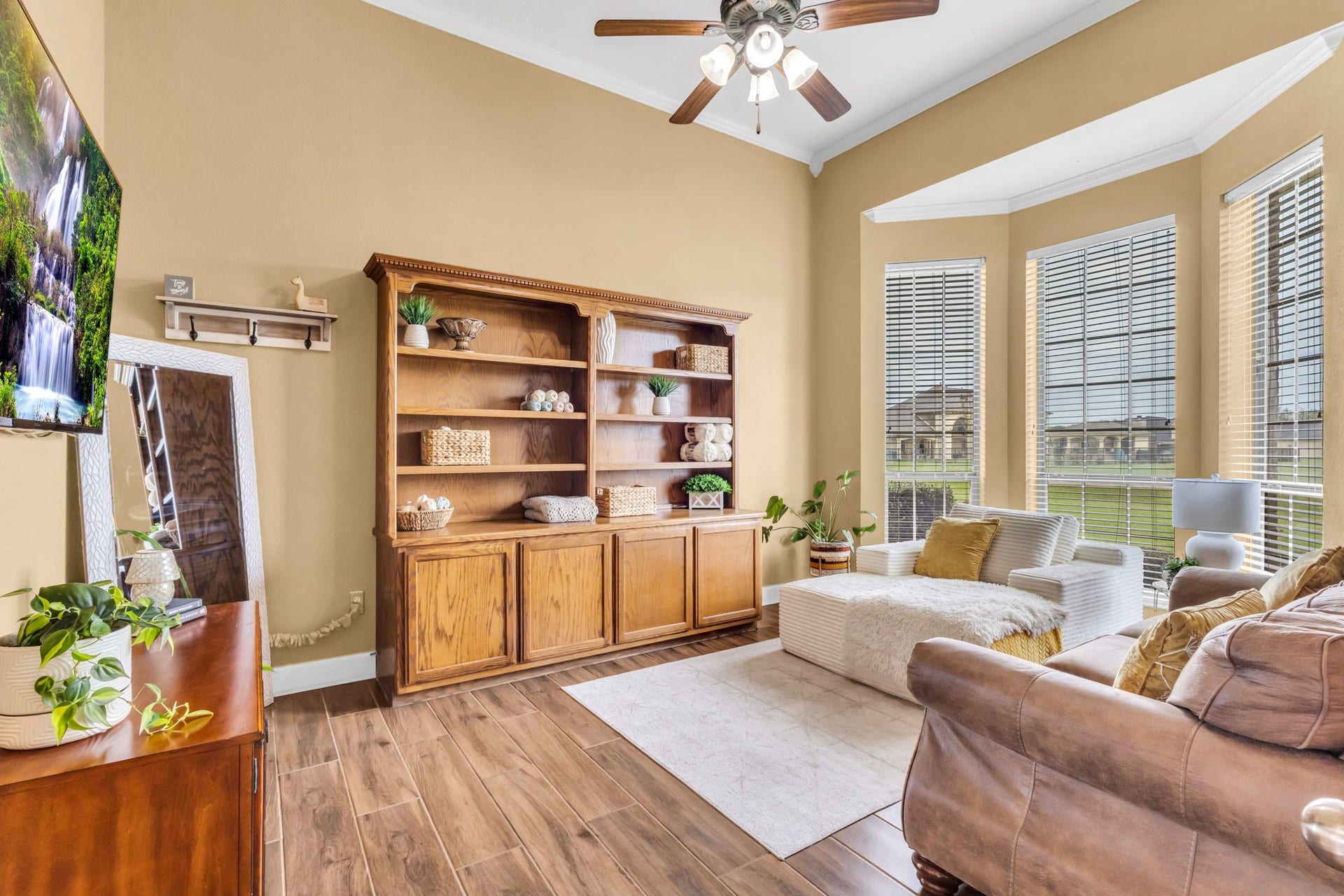 11010 Madison Court, Beaumont, TX 77705 Spacious study featuring high ceilings, wood-look tile flooring, and a beautiful bay window that brings in plenty of natural light. A comfortable space for a home office or quiet retreat.