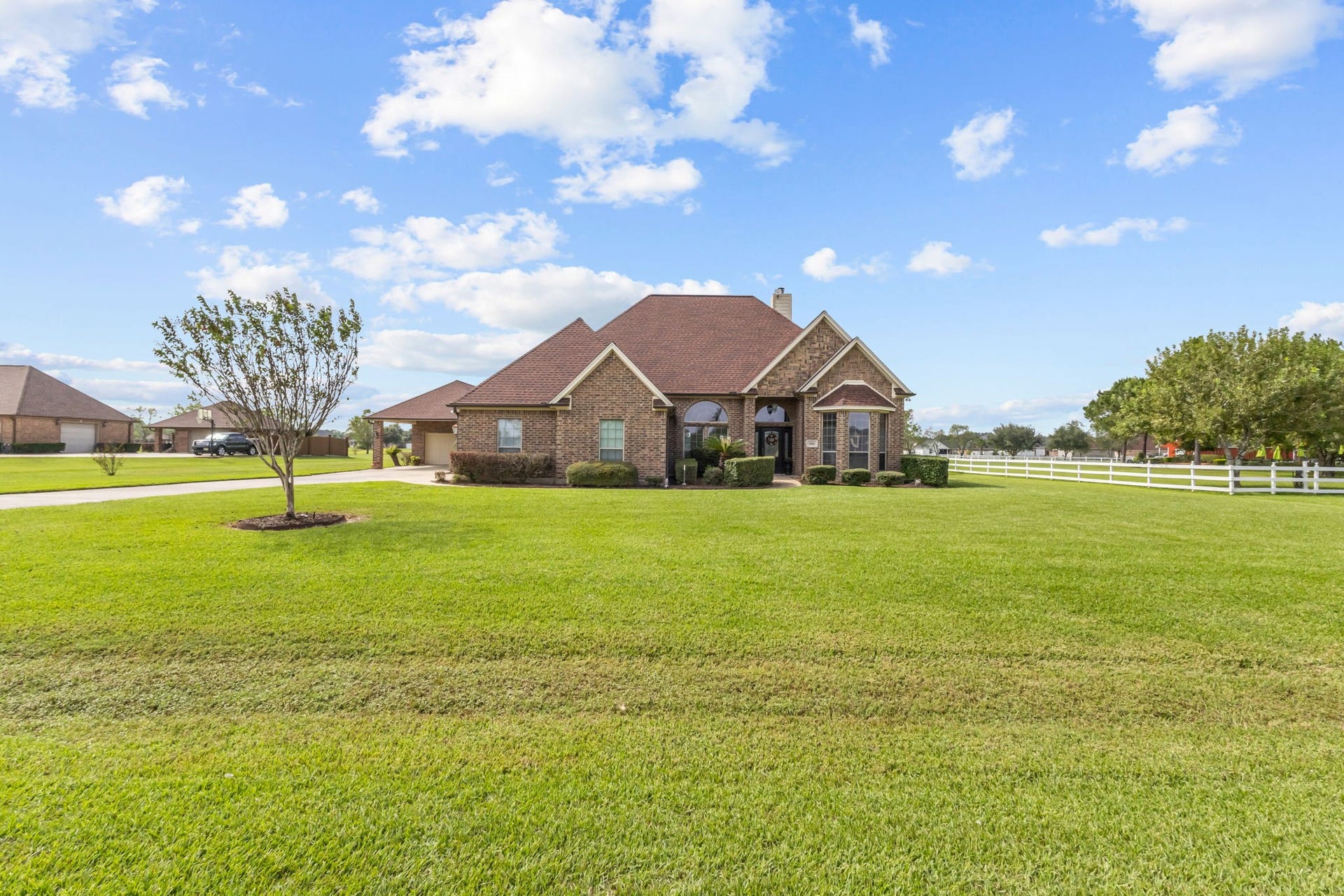 11010 Madison Court, Beaumont, TX 77705 Enjoy the open, spacious setting of this property, featuring a generous front yard.The wide driveway provides convenient access to the home and detached garage.