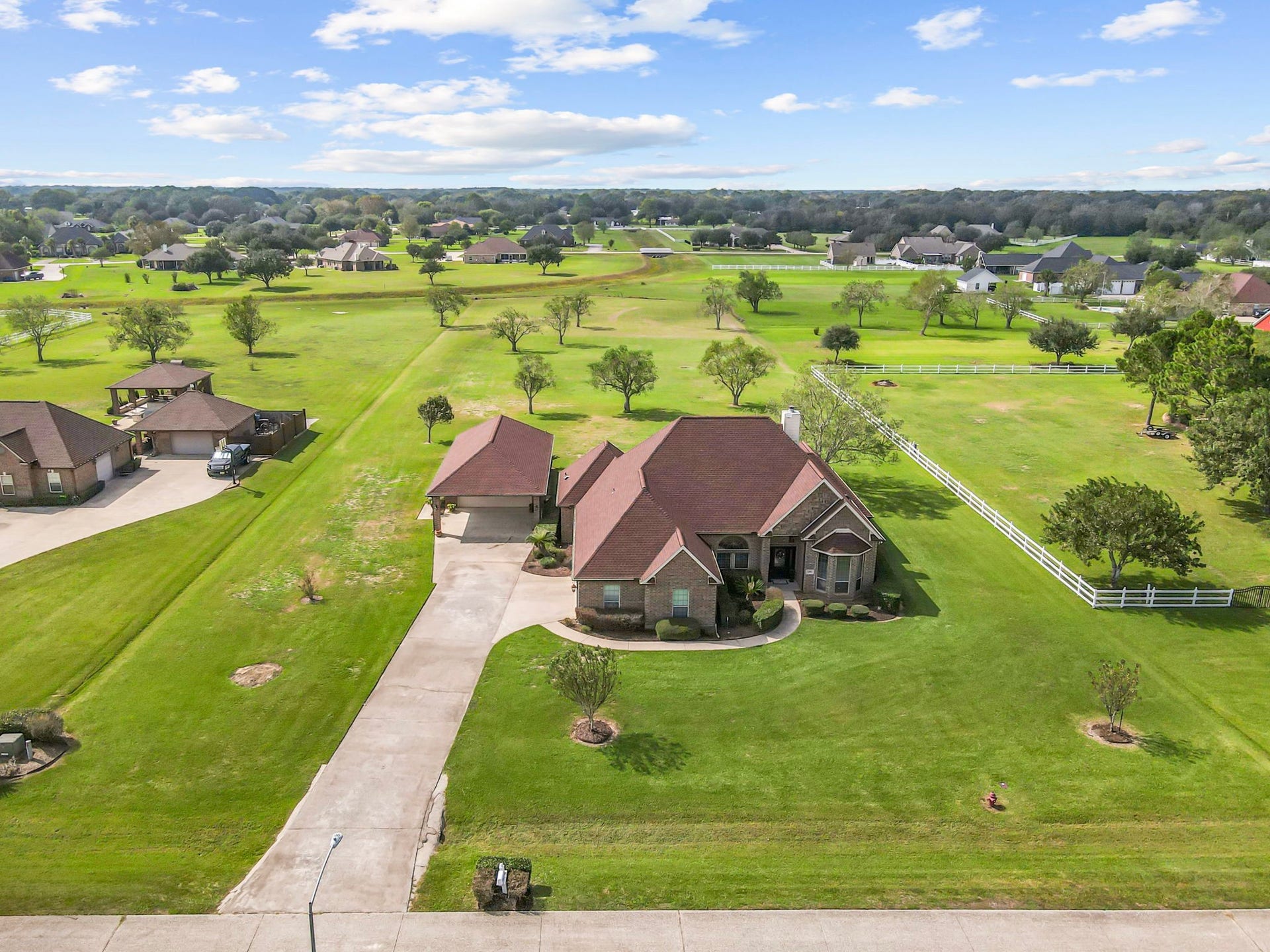 11010 Madison Court, Beaumont, TX 77705 Writing
Beautiful aerial view showcasing this brick home situated on over 2 acres of beautifully maintained grounds. Featuring a long driveway, detached garage, mature trees, and expansive green space, this property offers plenty of room to enjoy outdoor living and make it your own.