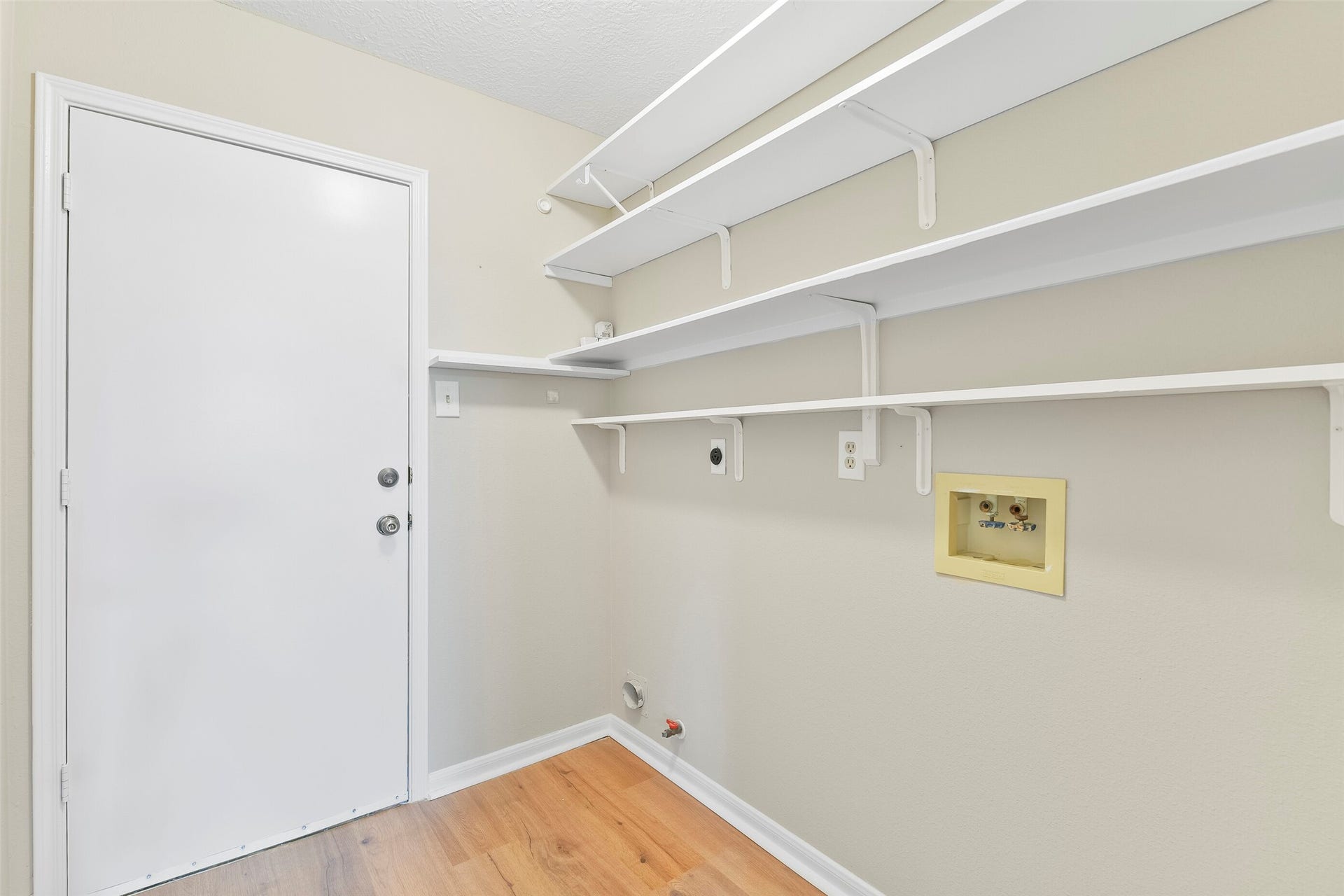 4335 Sugar Bars Drive, Friendswood, TX 77546 Large utility room with shelving ~
