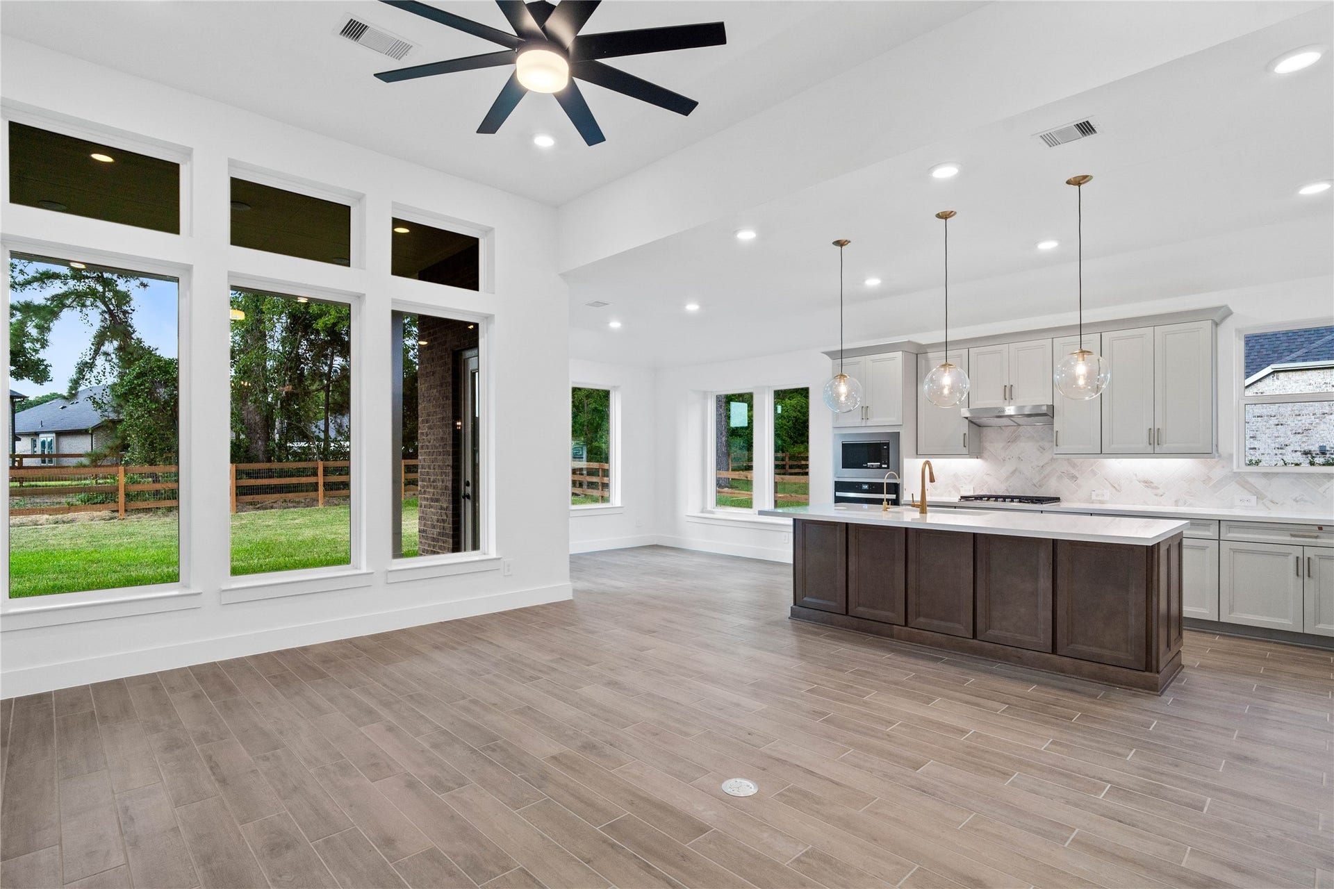17728 Gold Saddle Lane, Magnolia, TX 77354 Bright, open-concept living designed for both everyday comfort and effortless entertaining. This expansive space features soaring ceilings, abundant natural light, and seamless flow between the kitchen, dining, and living areas.